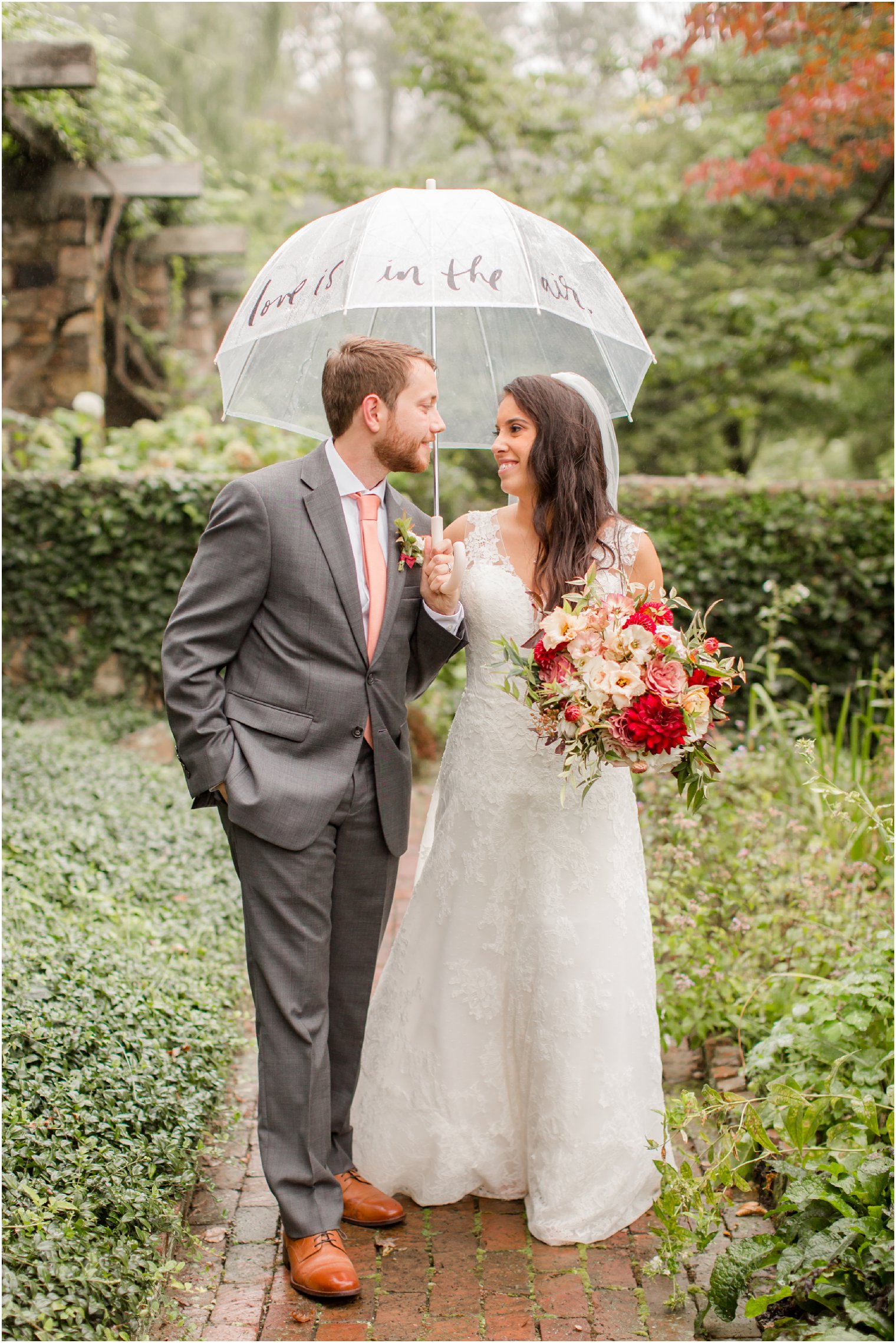 rainy day wedding portraits photographed by Idalia Photography at Olde Mill Inn