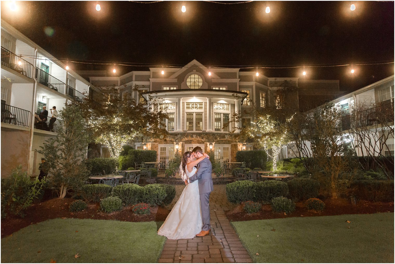 nighttime wedding portrait at Olde Mill Inn photographed by Idalia Photography