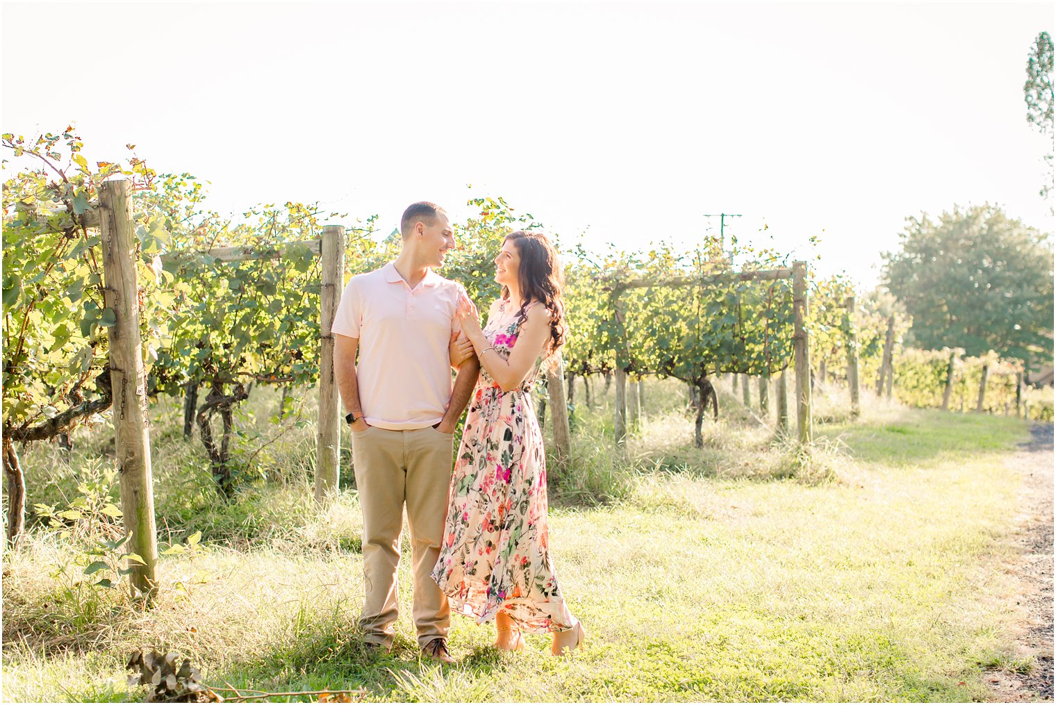 Couple posing for engagement photos at Cape May Winery and Vineyard