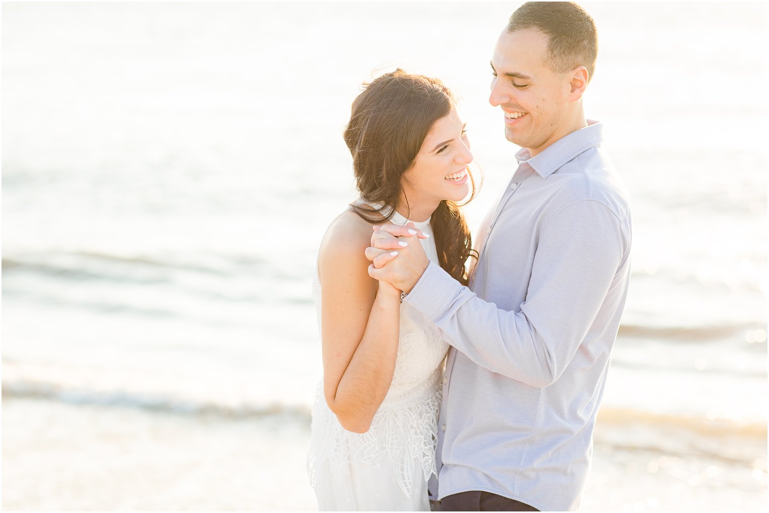 Happily engaged couple at Sunset Beach 
