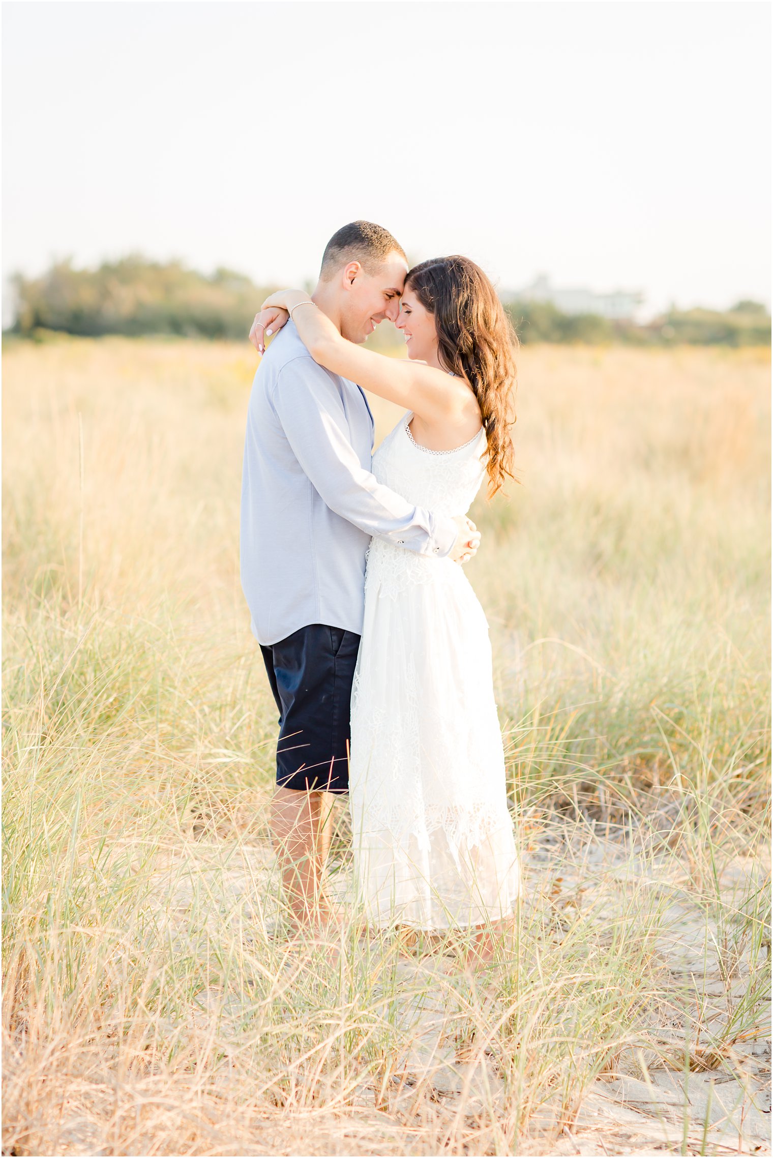 Romantic photo of engaged couple at Cape May's Sunset Beach