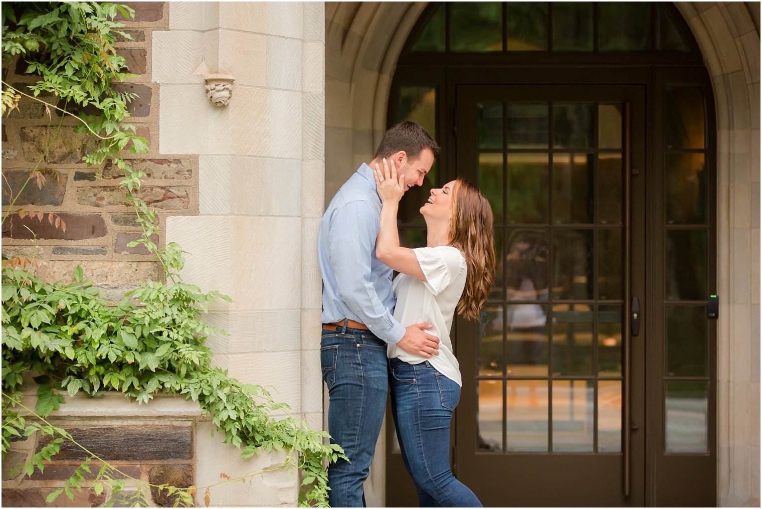 couple laughs during engagement session at Princeton University with Idalia Photography