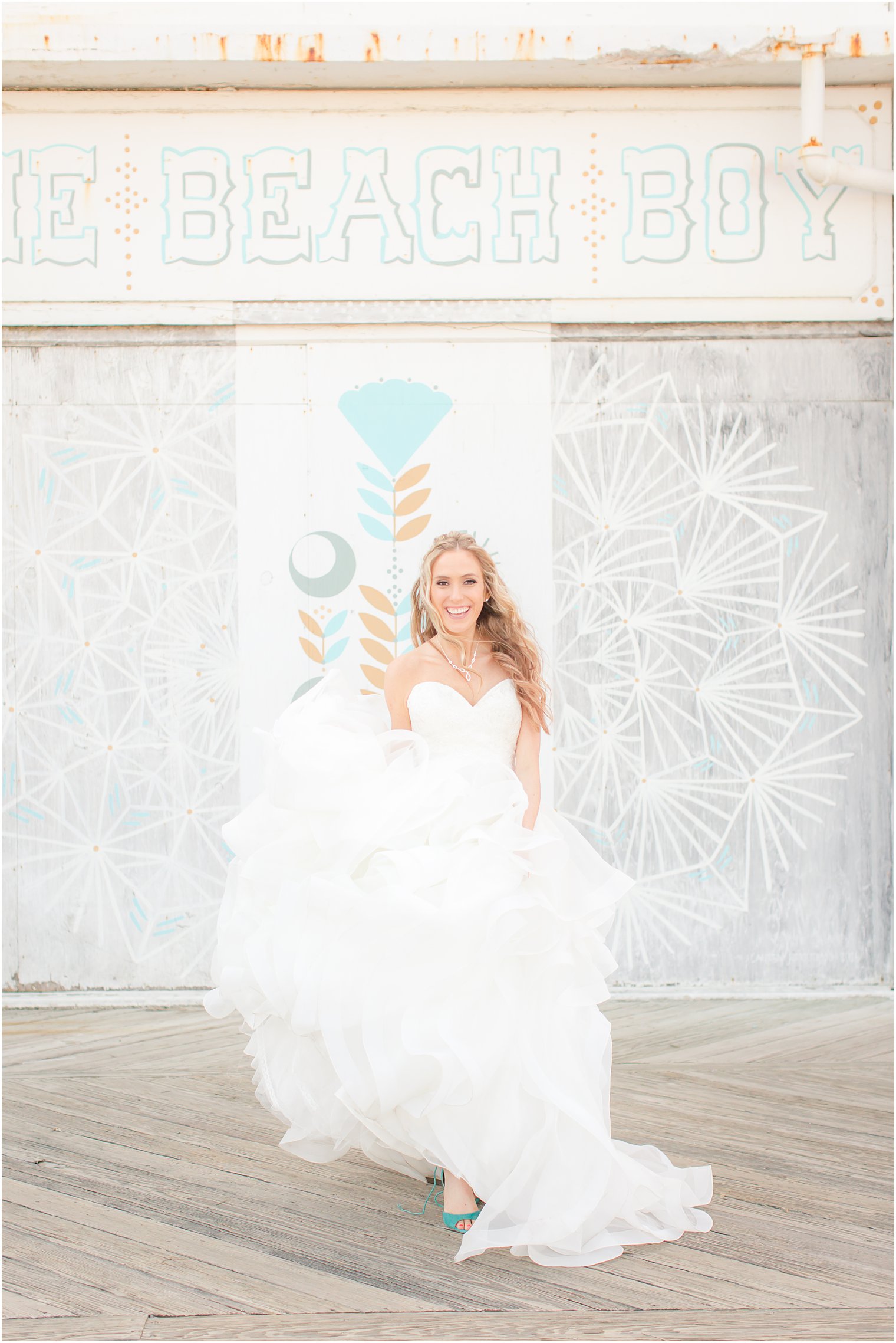 Bride showing off her wedding dress on the boardwalk in Asbury Park, NJ