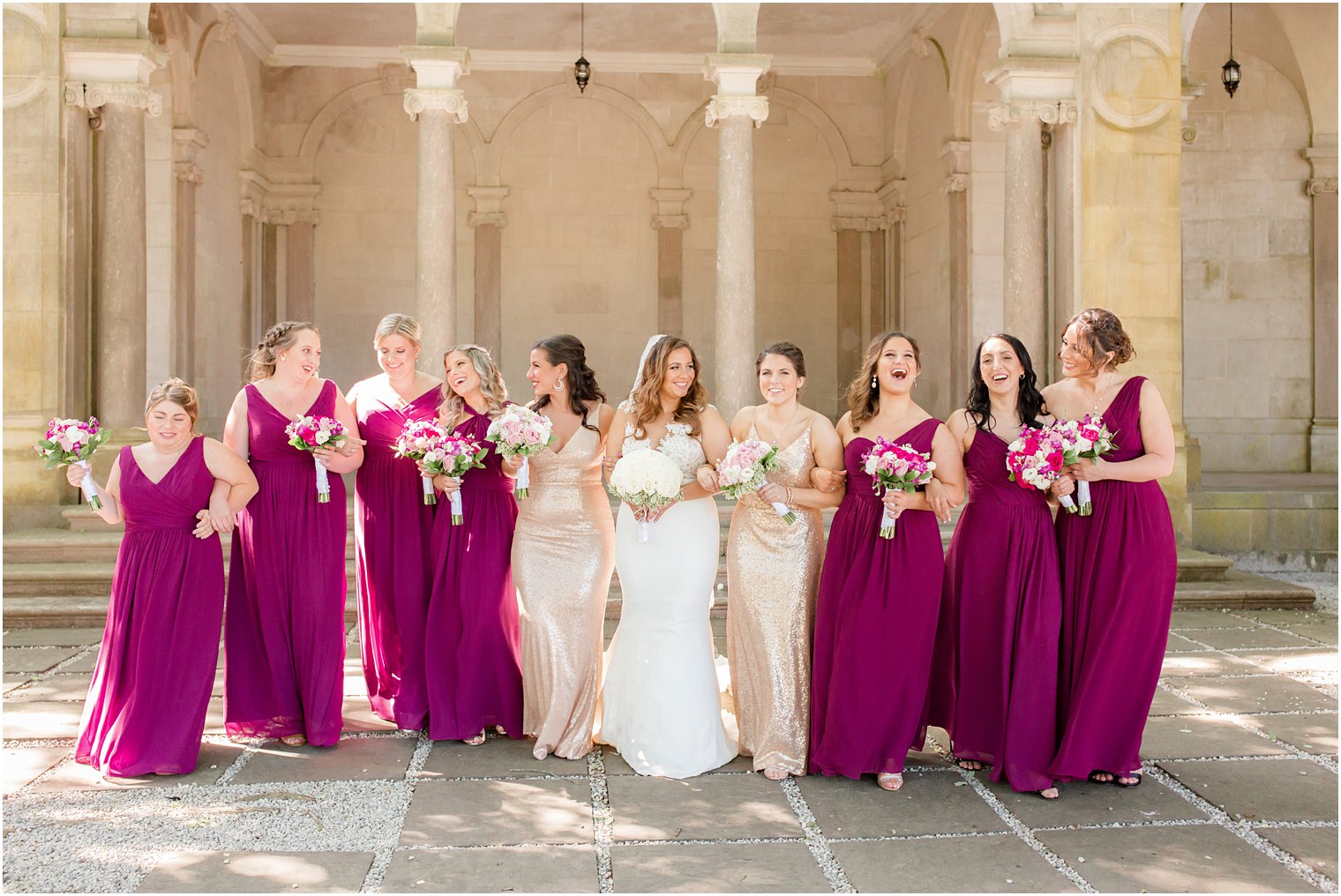 bridesmaids wearing magenta and gold dresses 