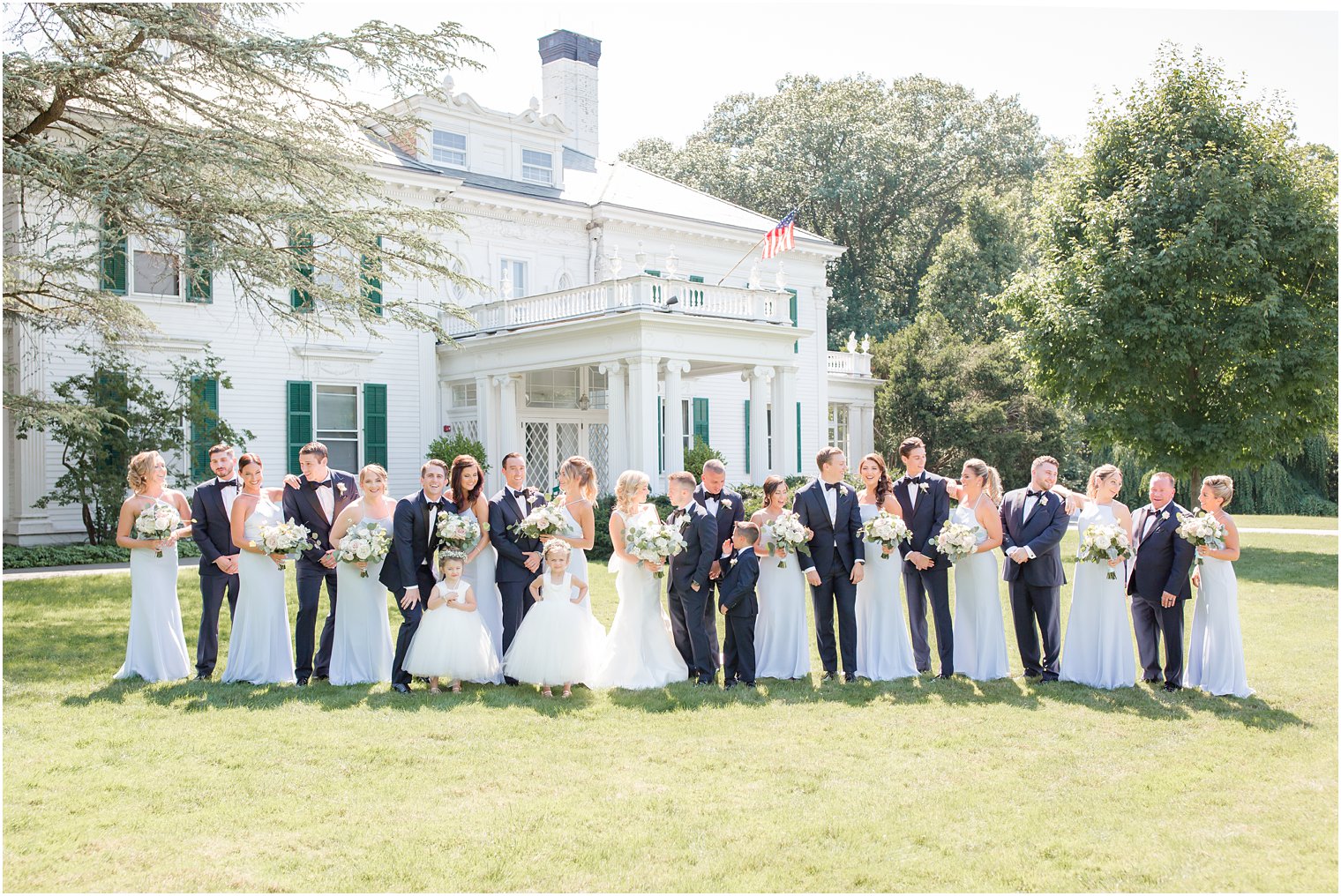 candid wedding party photo with soft blue and navy blue color palette