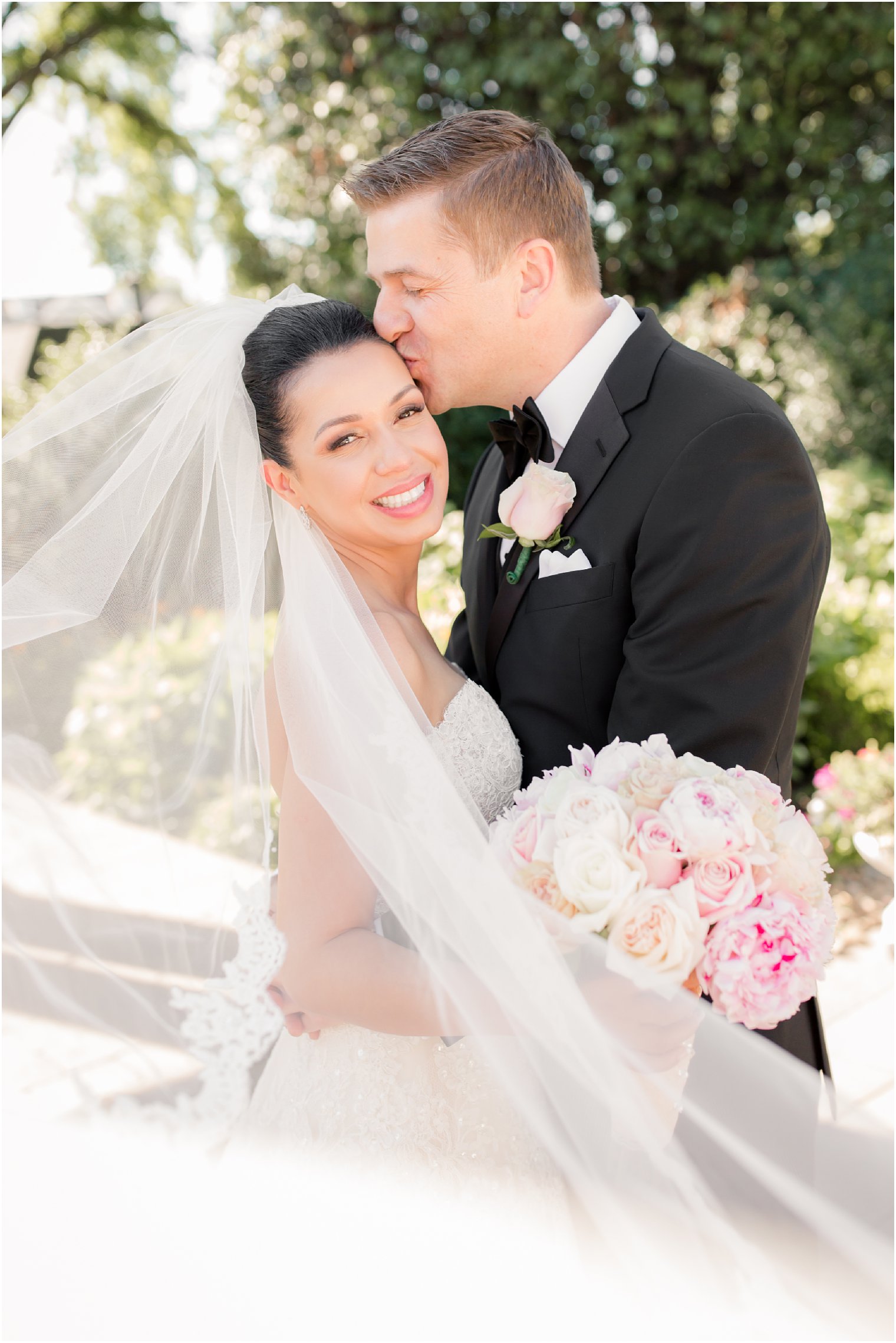bride and groom portrait with long veil