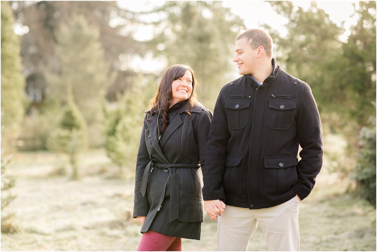 candid photo of couple on a tree farm