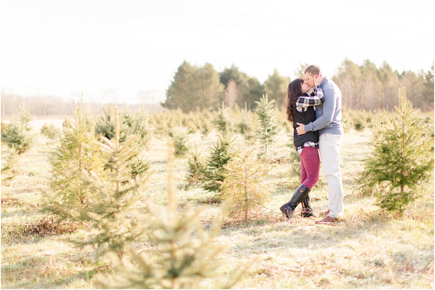Christmas tree farm engagement by Idalia Photography
