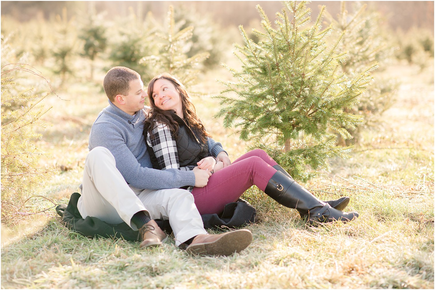 candid photo of engaged couple at tree farm