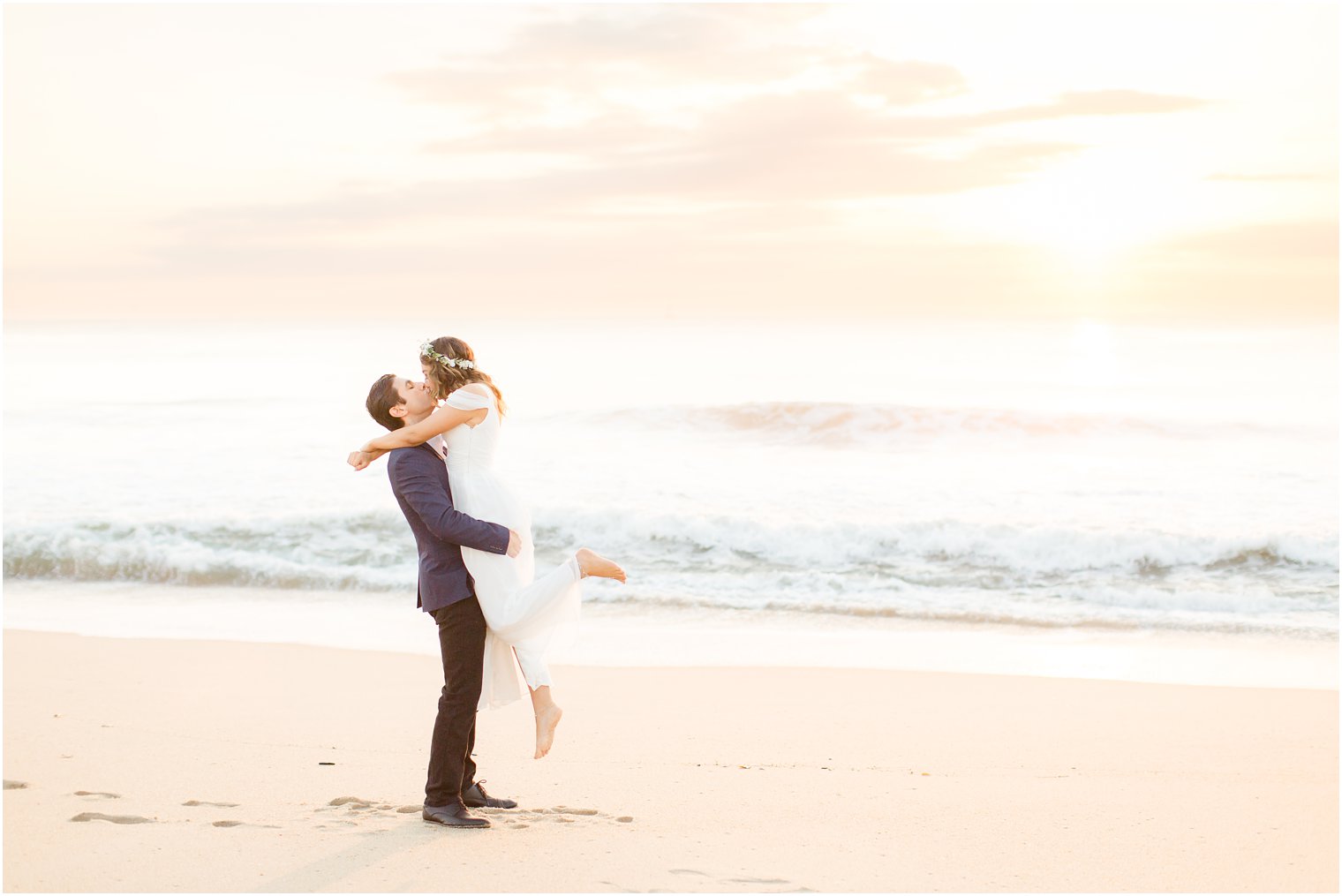 romantic photo of engaged couple on the beach
