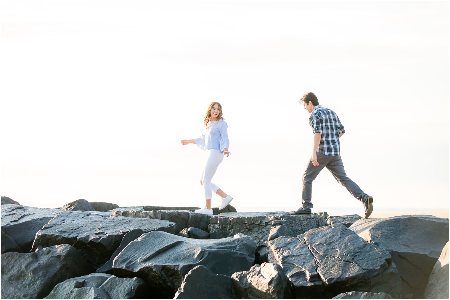 documentary style engagement photo on a jetty
