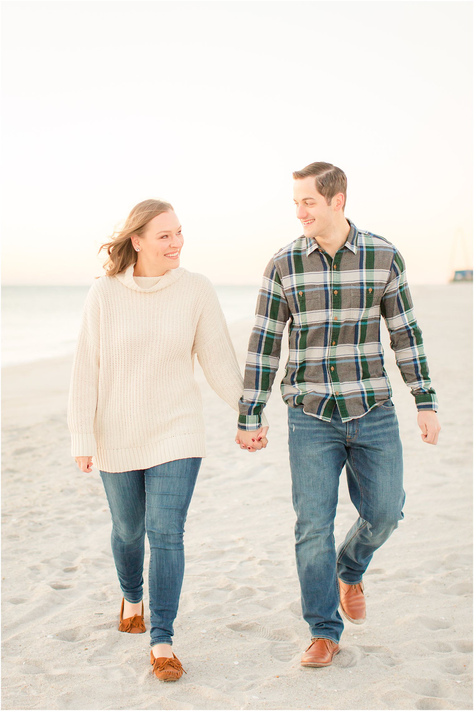 couple walking on the beach in Lavallette, NJ