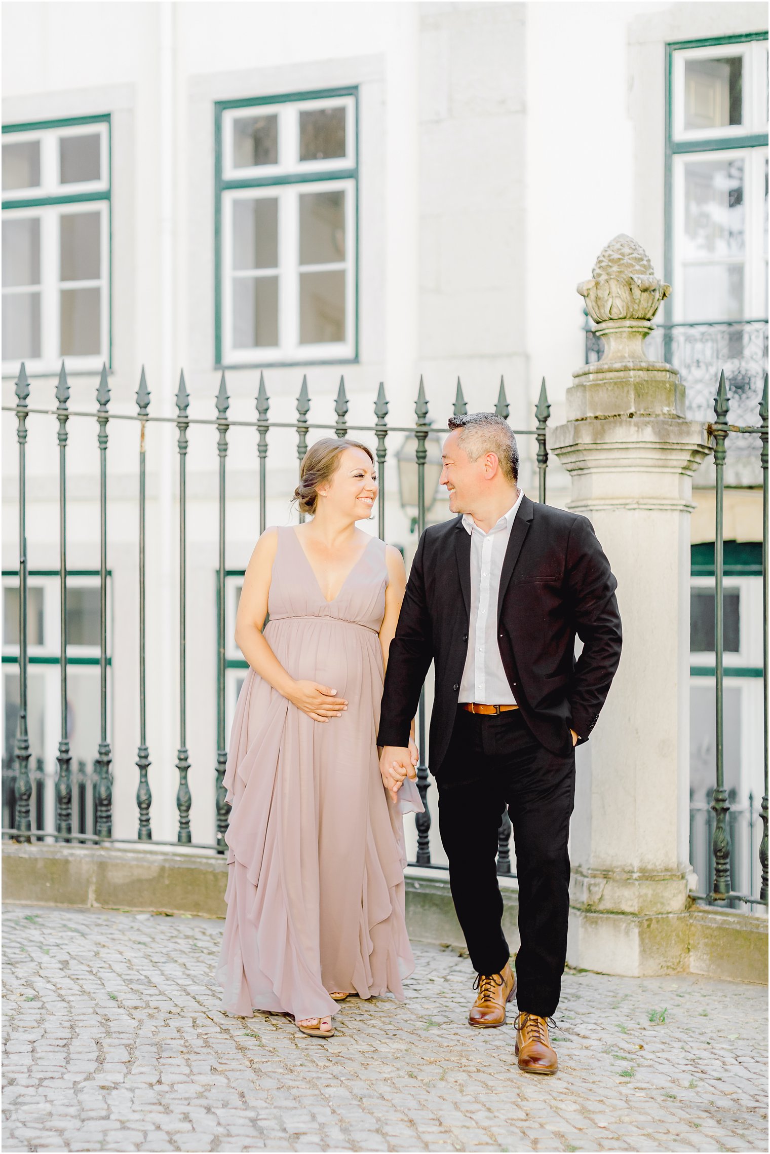 married couple walking in Alfama neighborhood