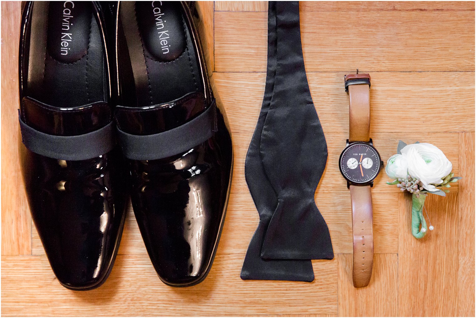 groom shoe, bow tie, watch, and boutonniere