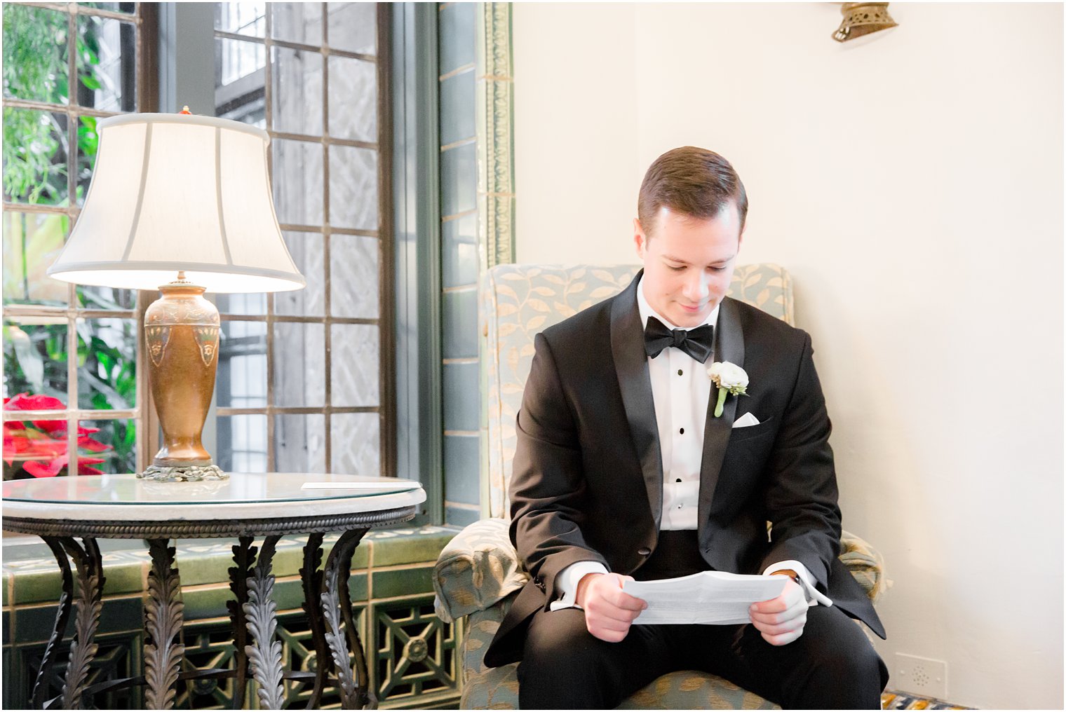 groom reading letter from bride