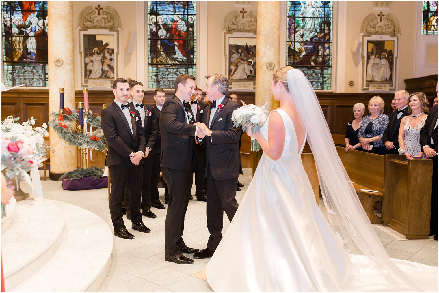 groom and father of the bride shaking hands at Church of the Immaculate Conception in Montclair, NJ