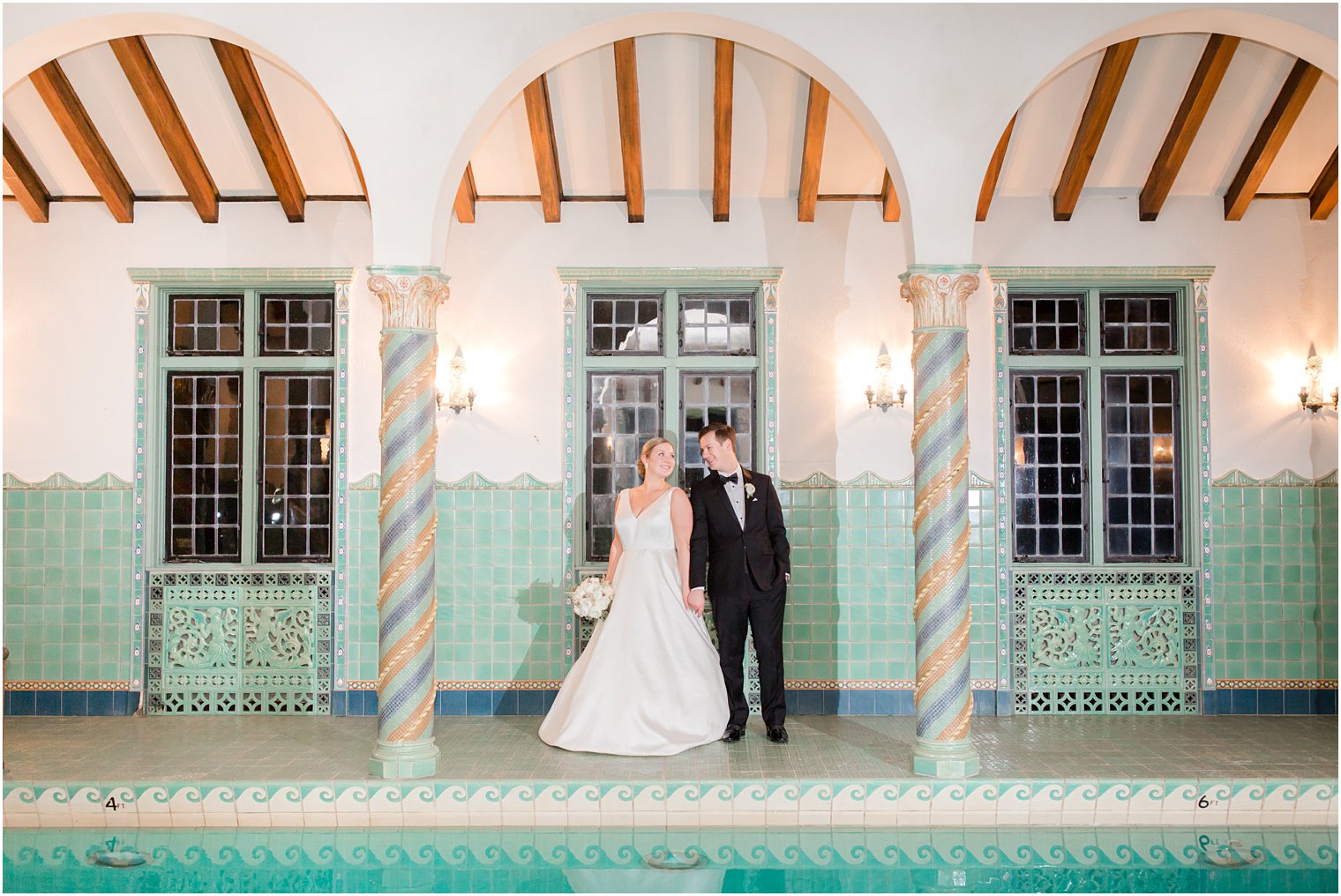 bride and groom posing for photos at Pleasantdale Chateau