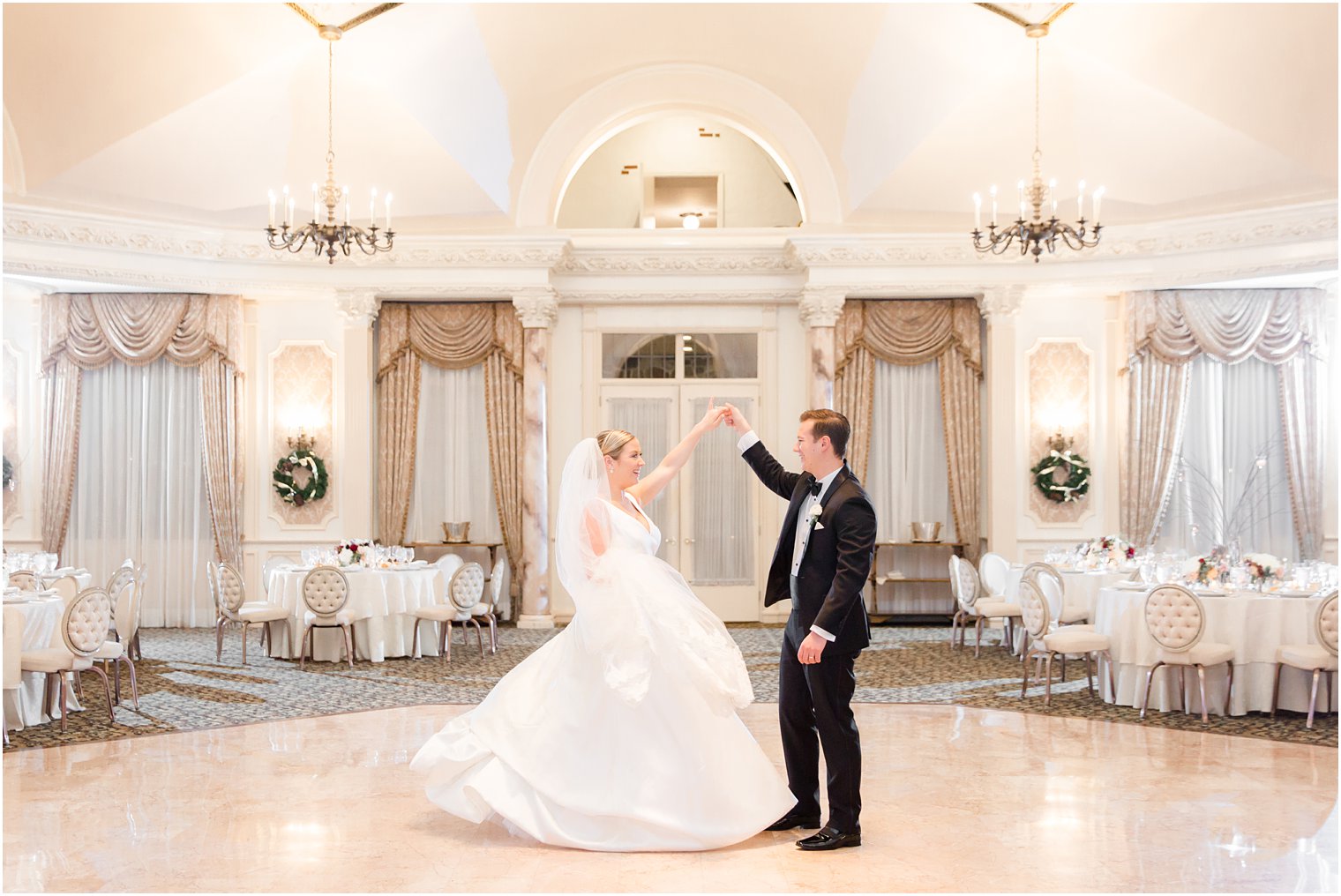 groom twirling his bride at Pleasantdale Chateau