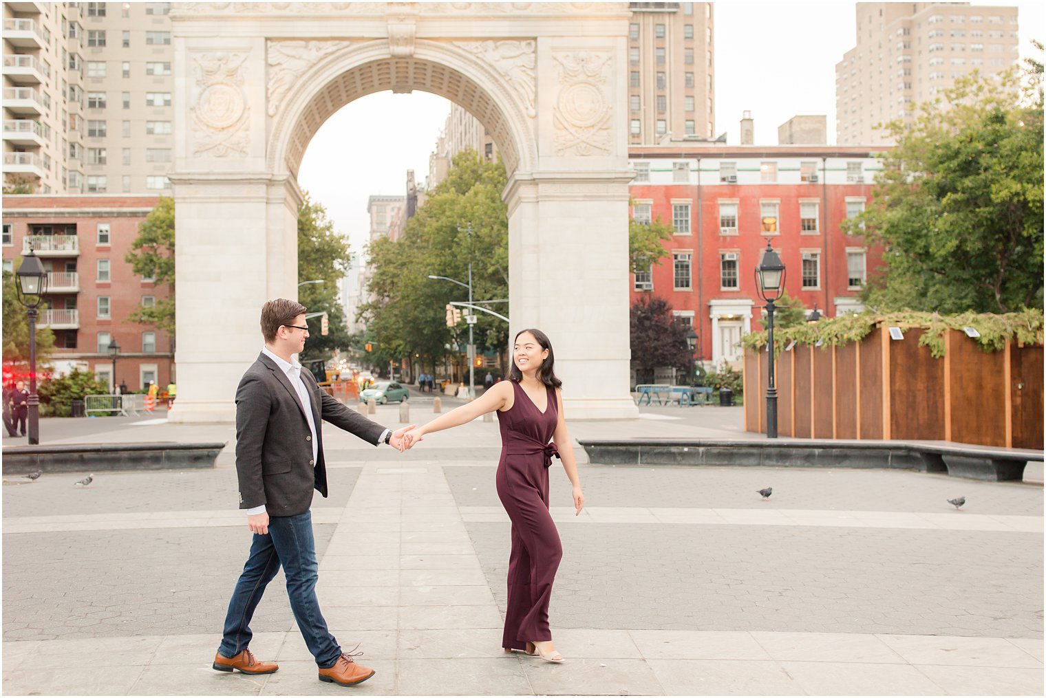 candid engagement photo at Washington Square Park