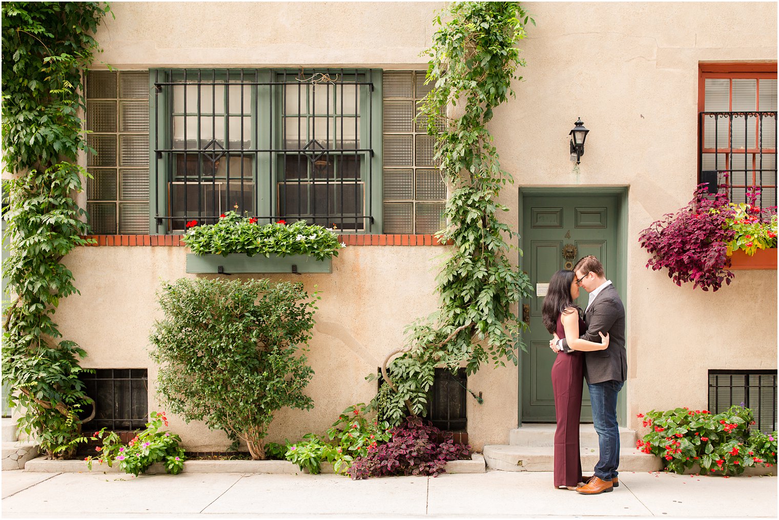 couple posing for engagement photos on NYU campus