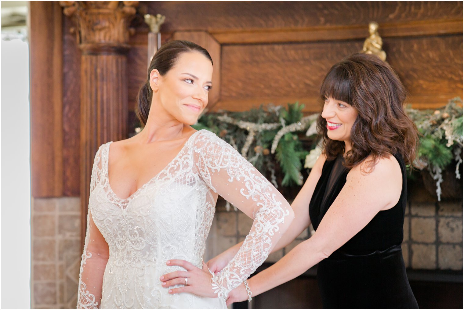 bride putting on her wedding dress