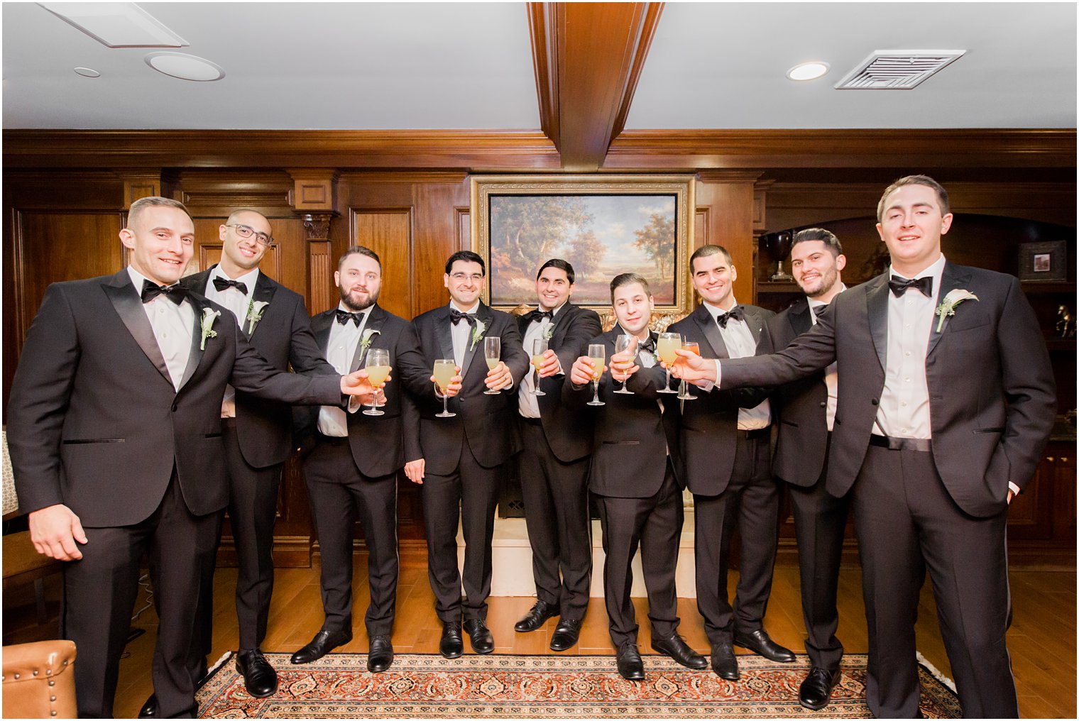 groomsmen toasting at the groom's den at Park Savoy Estate