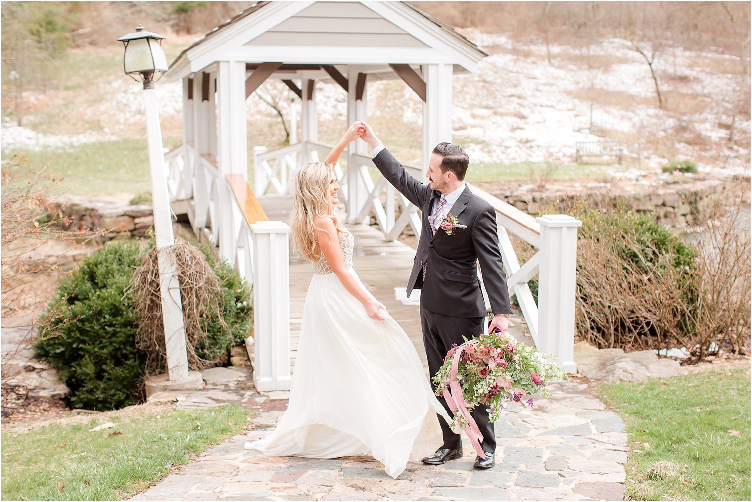 bride and groom twirling photo