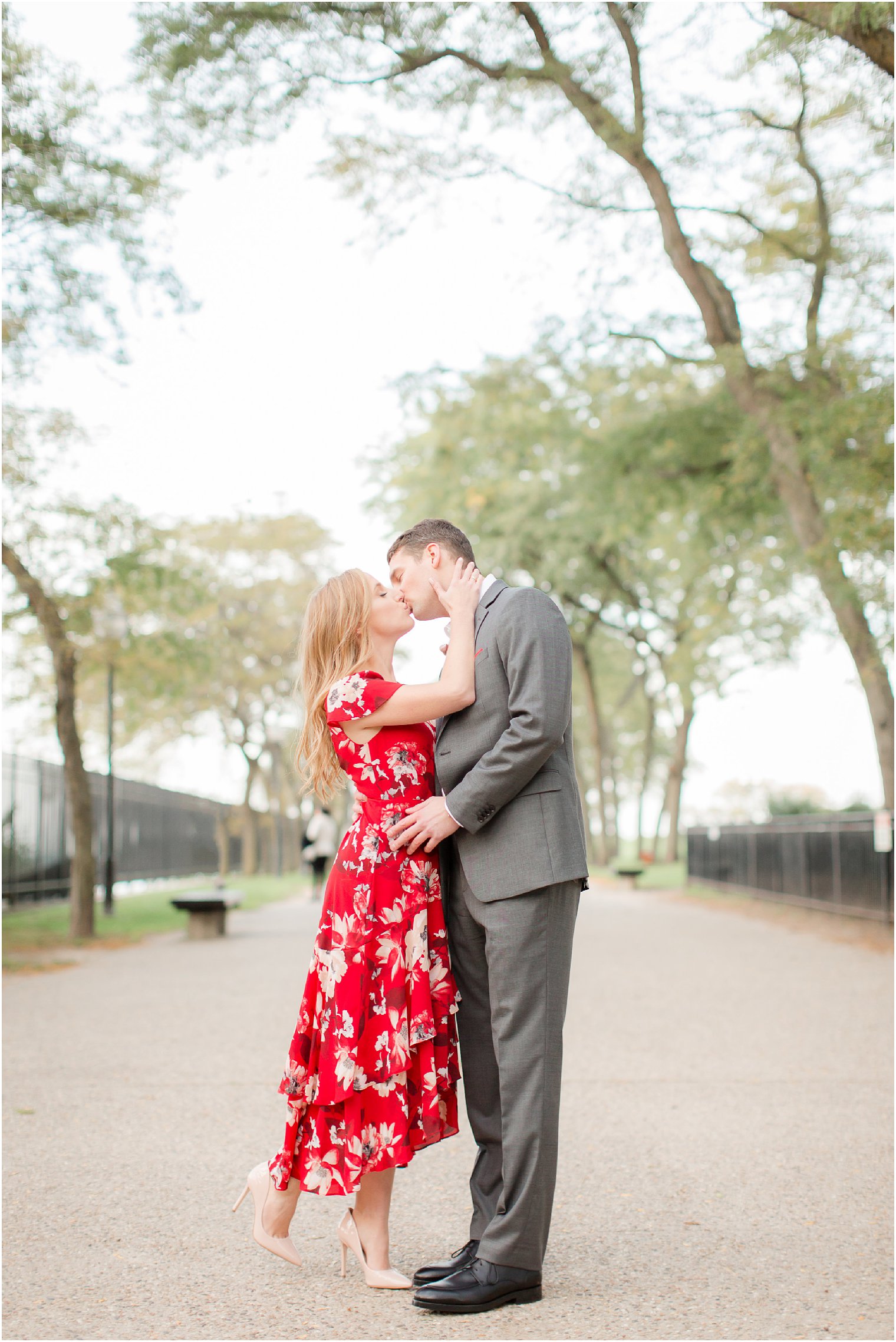 engagement photos at Milton Lee Olive Park featuring the Chicago skyline