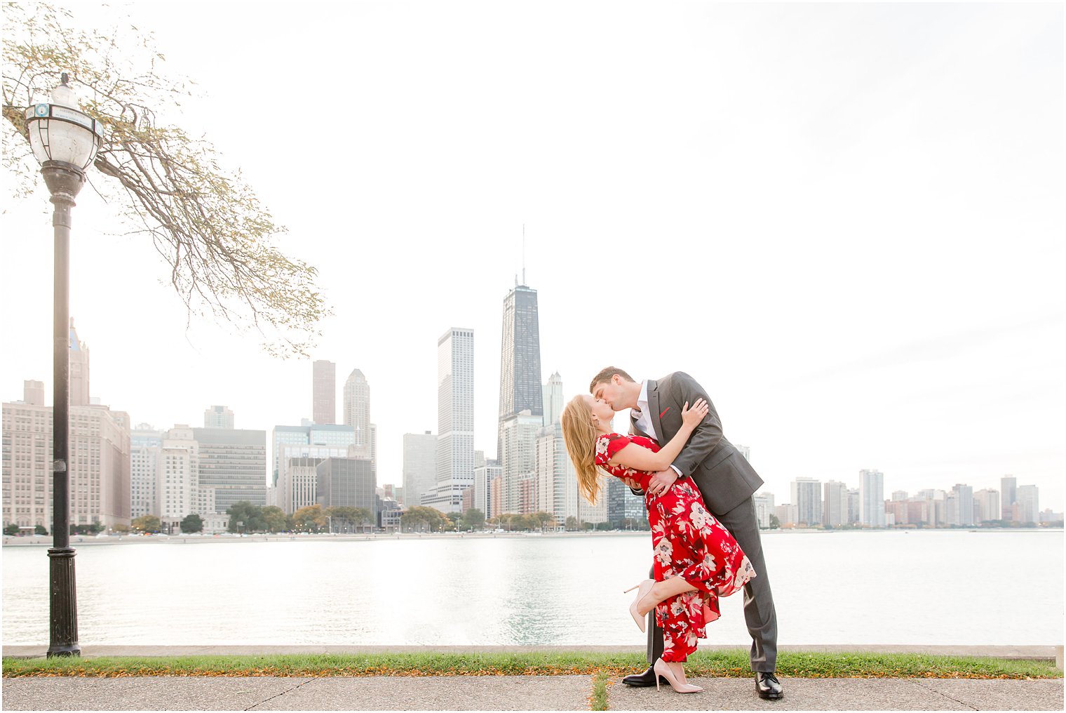 engagement photos at Milton Lee Olive Park featuring the Chicago skyline