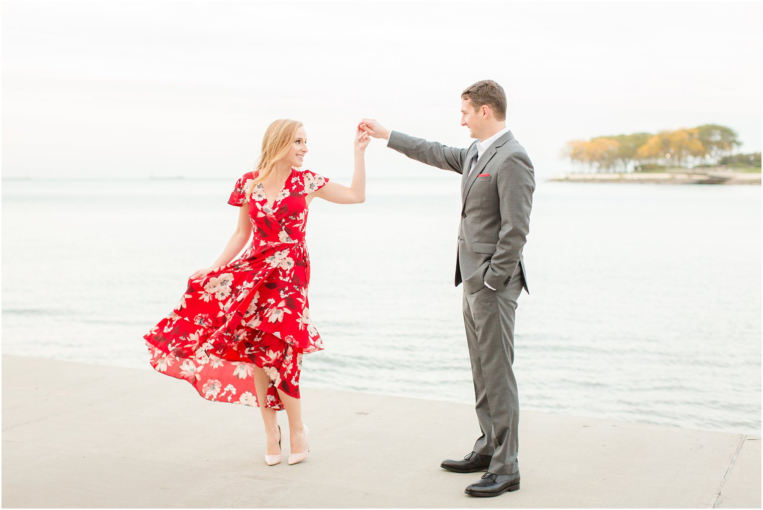 engagement photos at Milton Lee Olive Park featuring the Chicago skyline