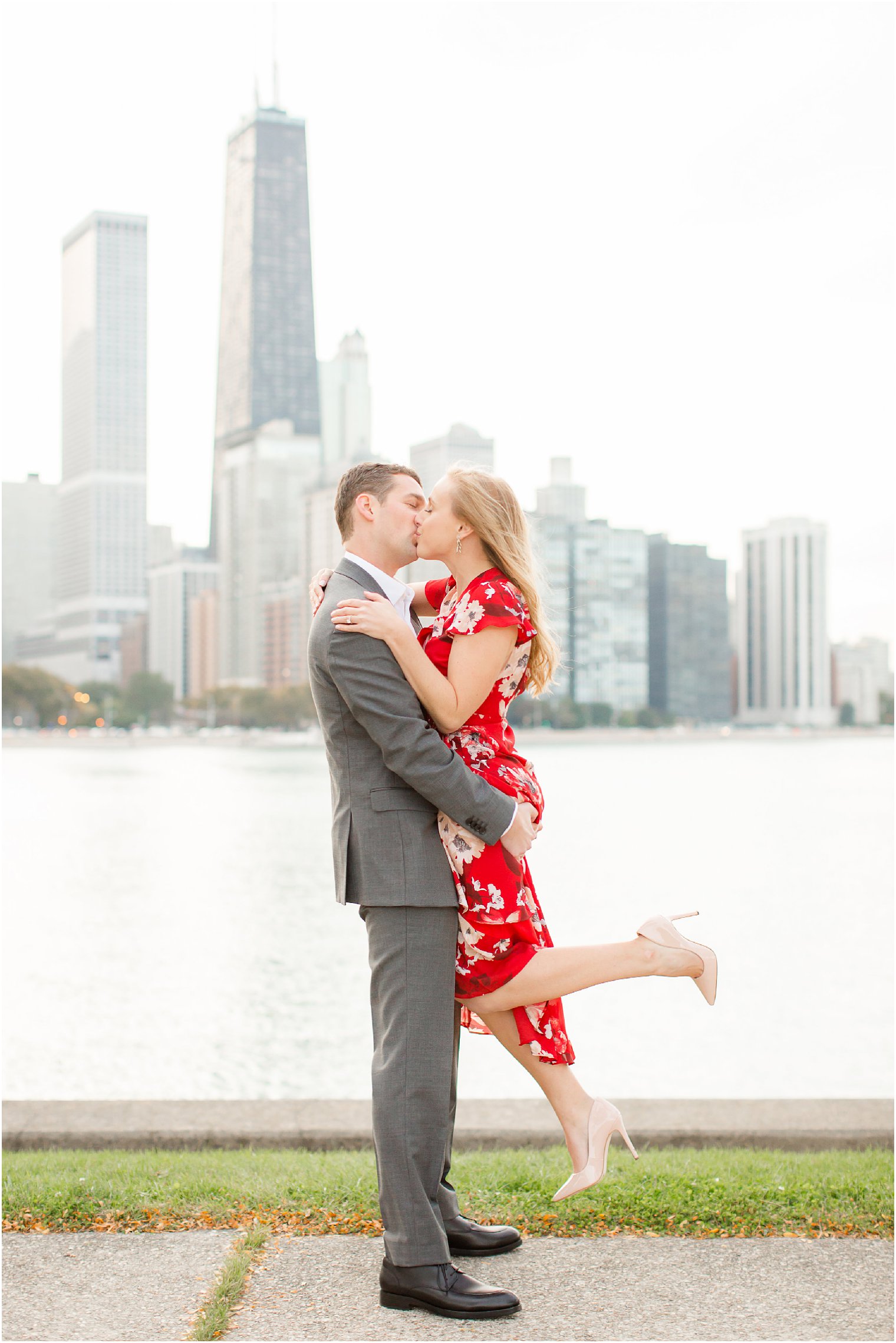 engagement photos at Milton Lee Olive Park featuring the Chicago skyline