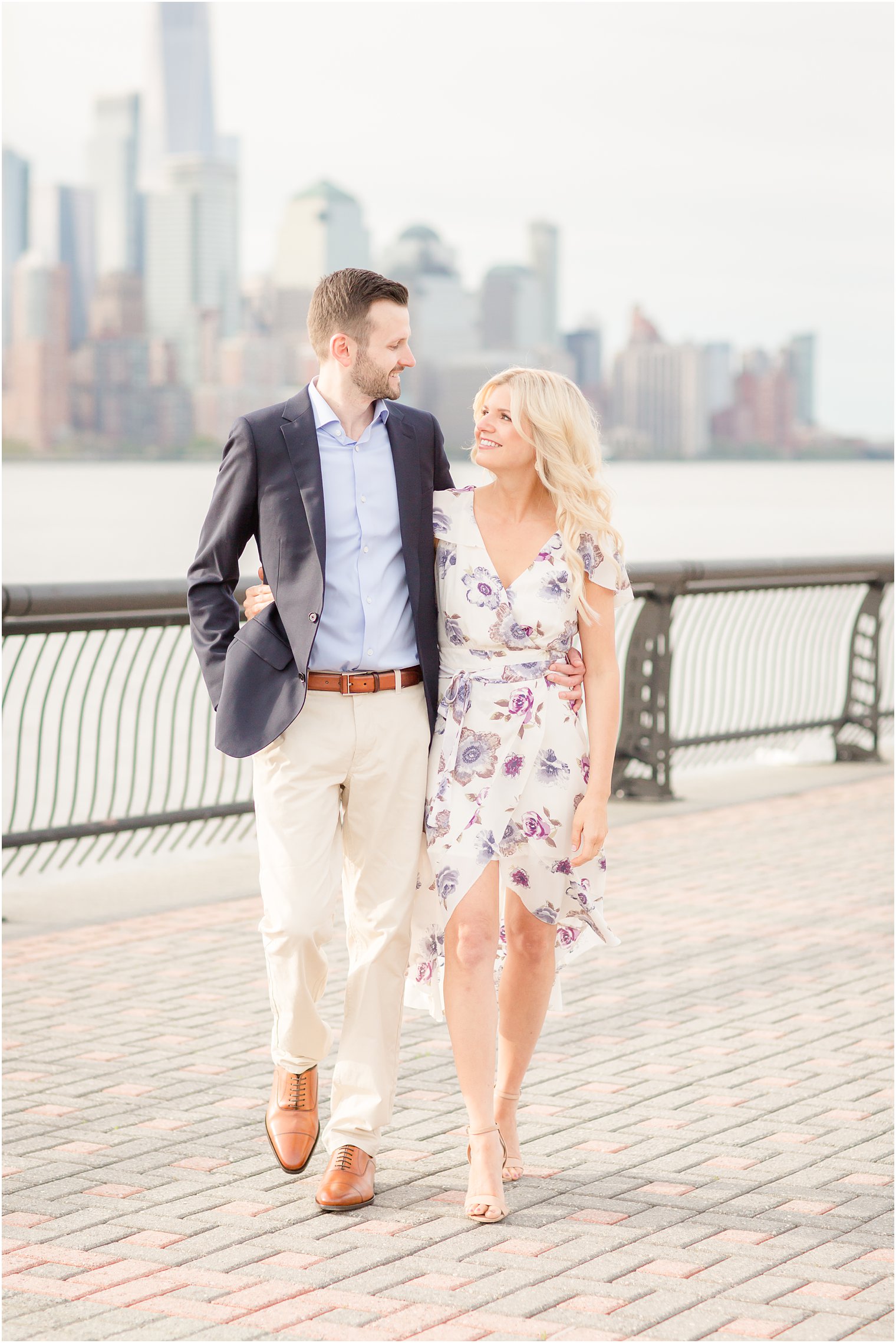 candid Hoboken skyline engagement photo