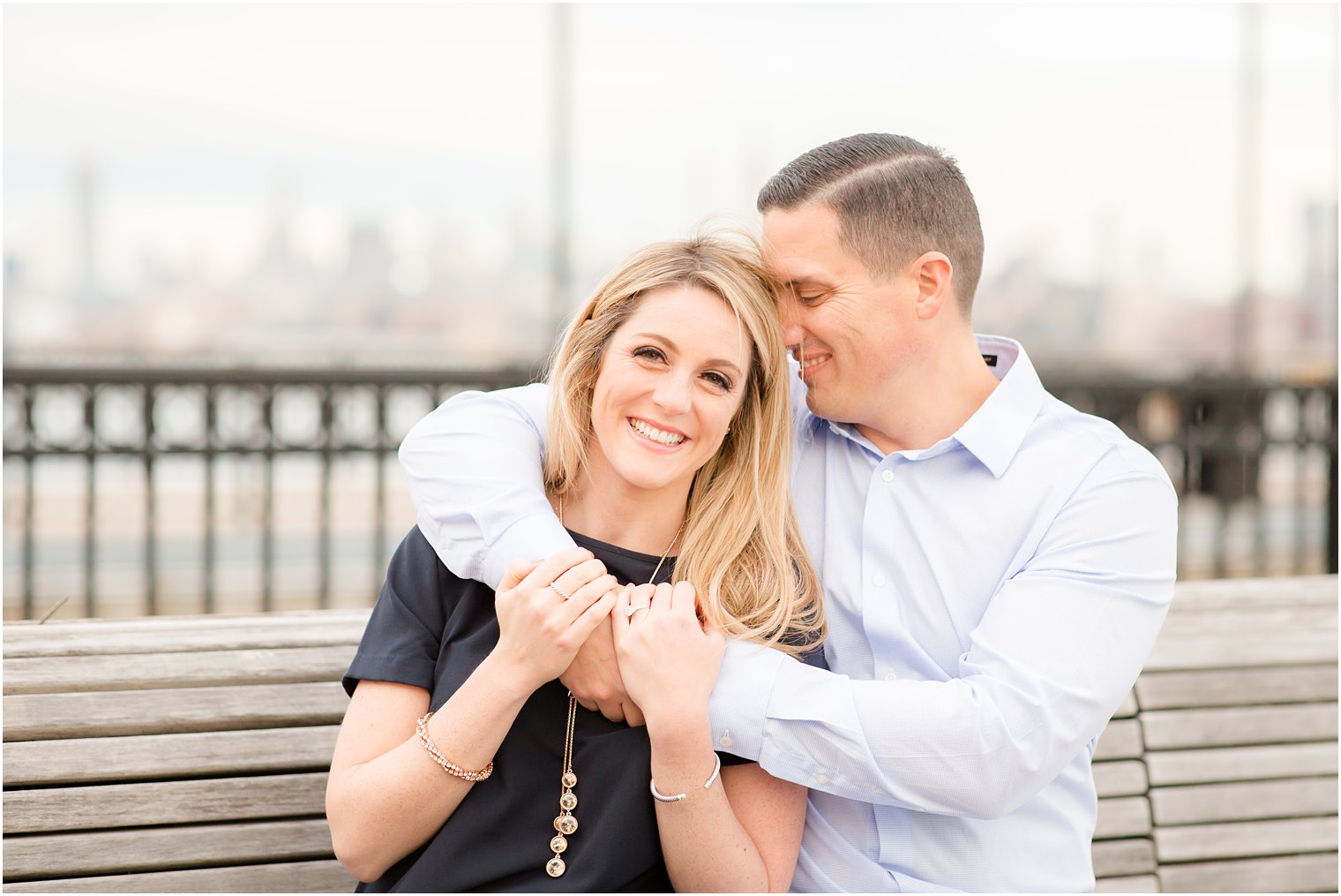 Cute couple cuddling for engagement photos