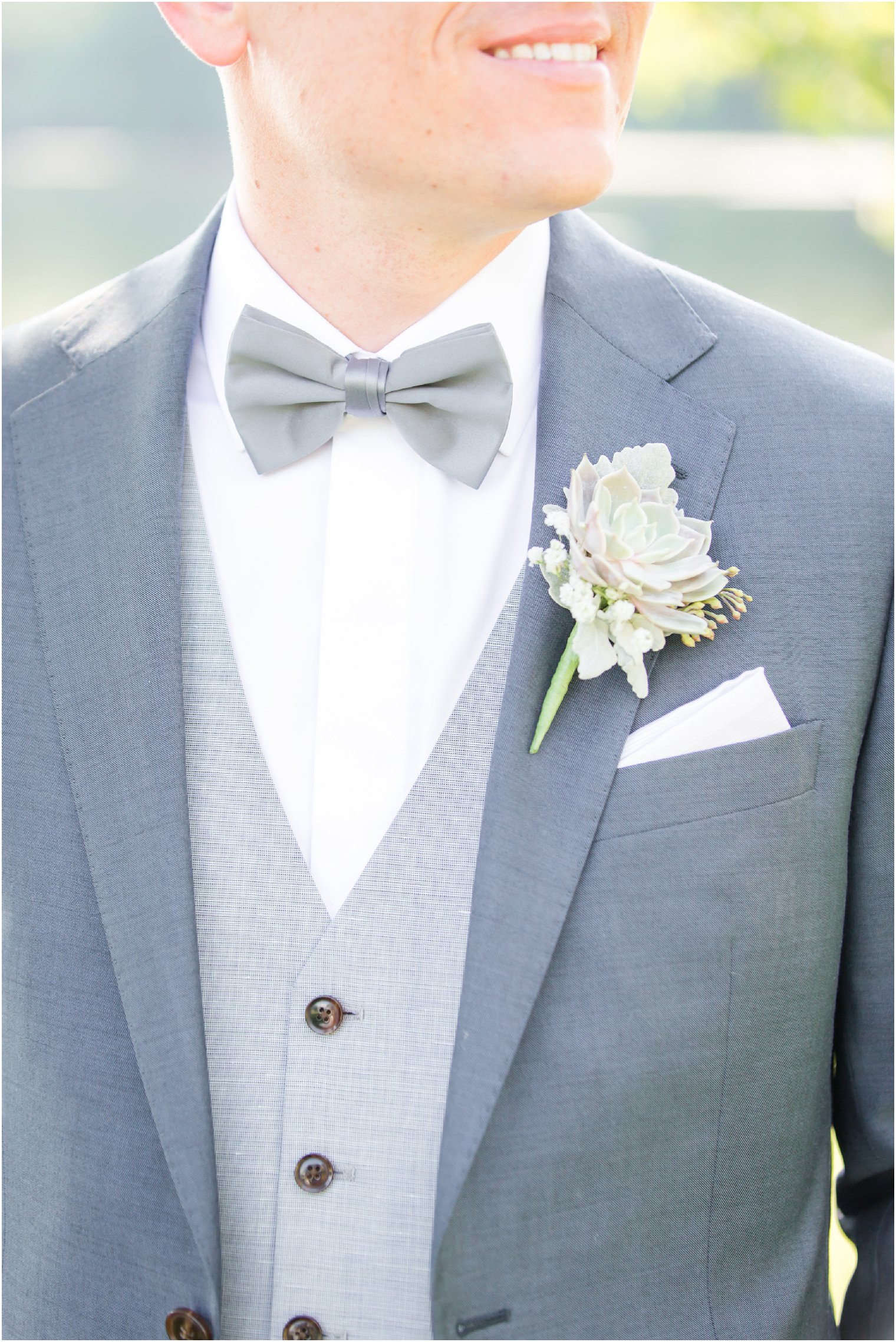 groom wearing blue suit 