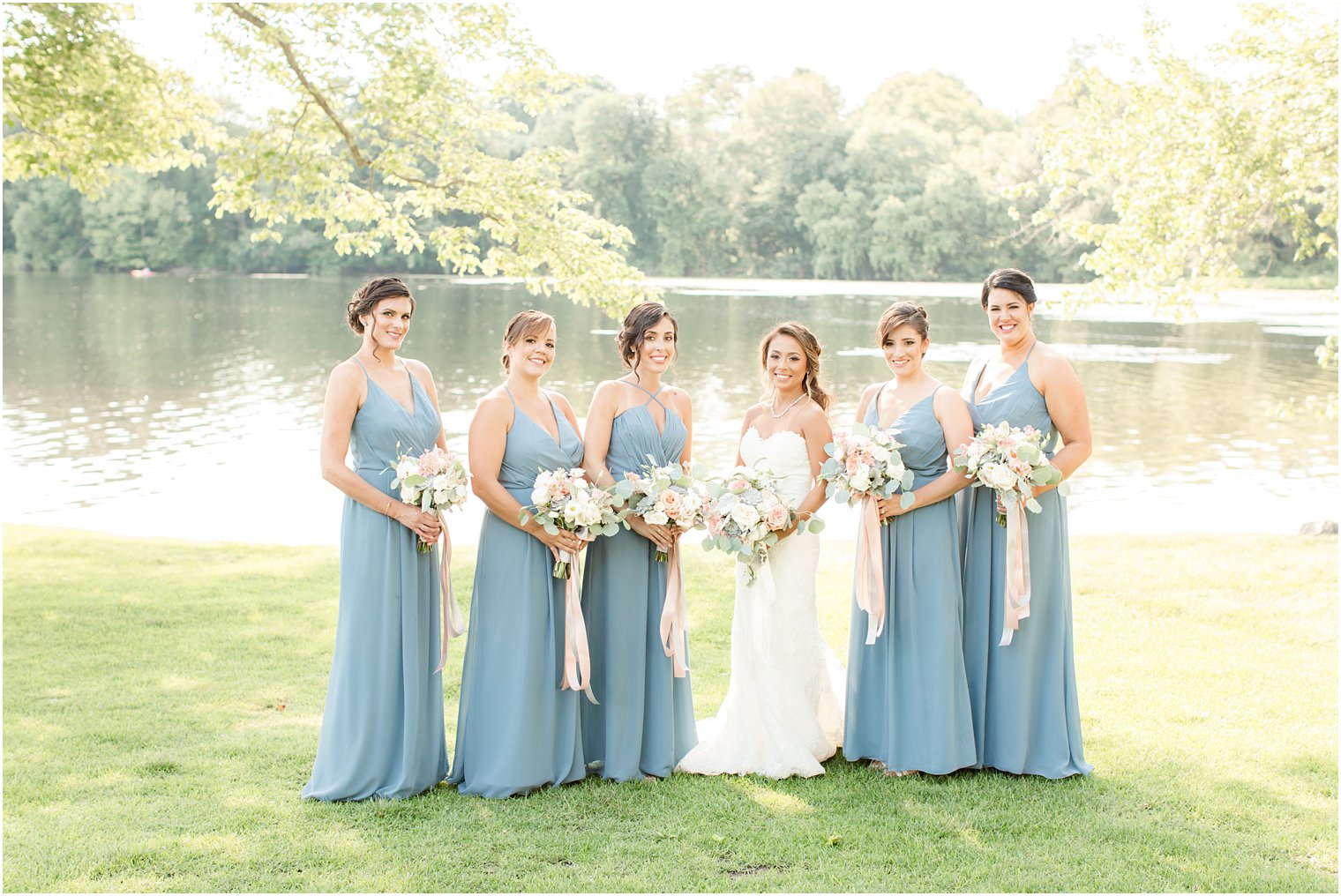bridesmaids wearing blue Bill Levkoff dresses