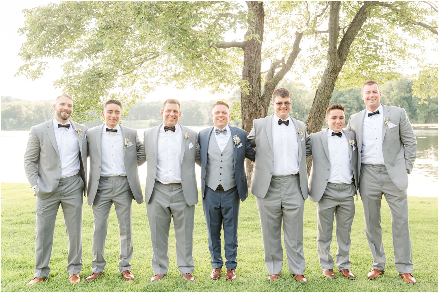 Groom and groomsmen wearing blue and gray