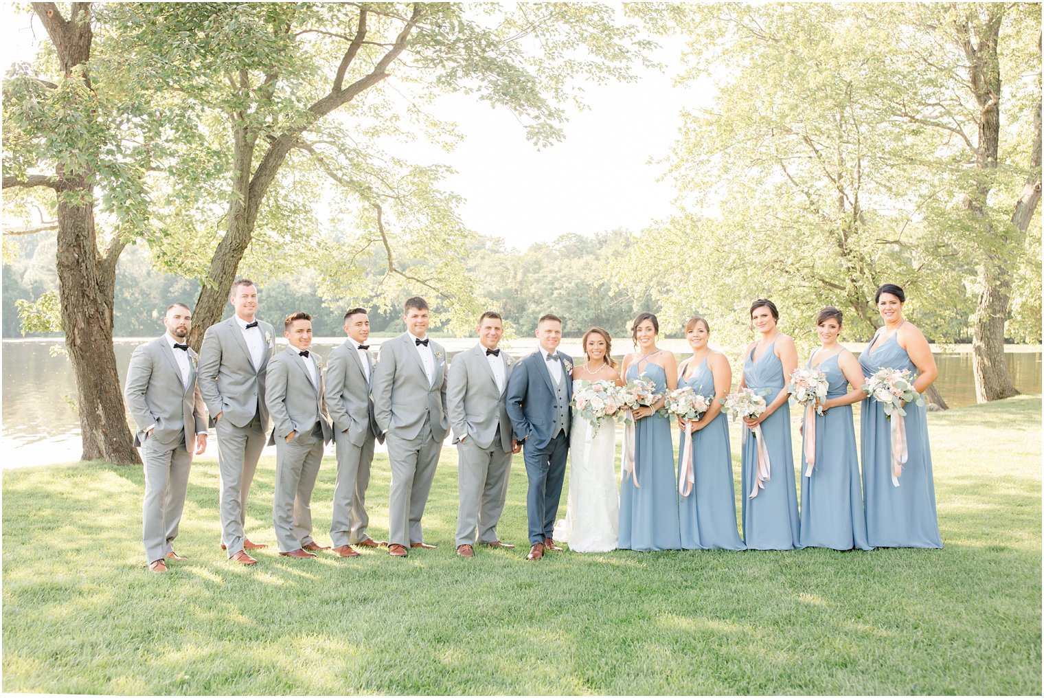 bridal party wearing blue and gray | dresses by bill levkoff