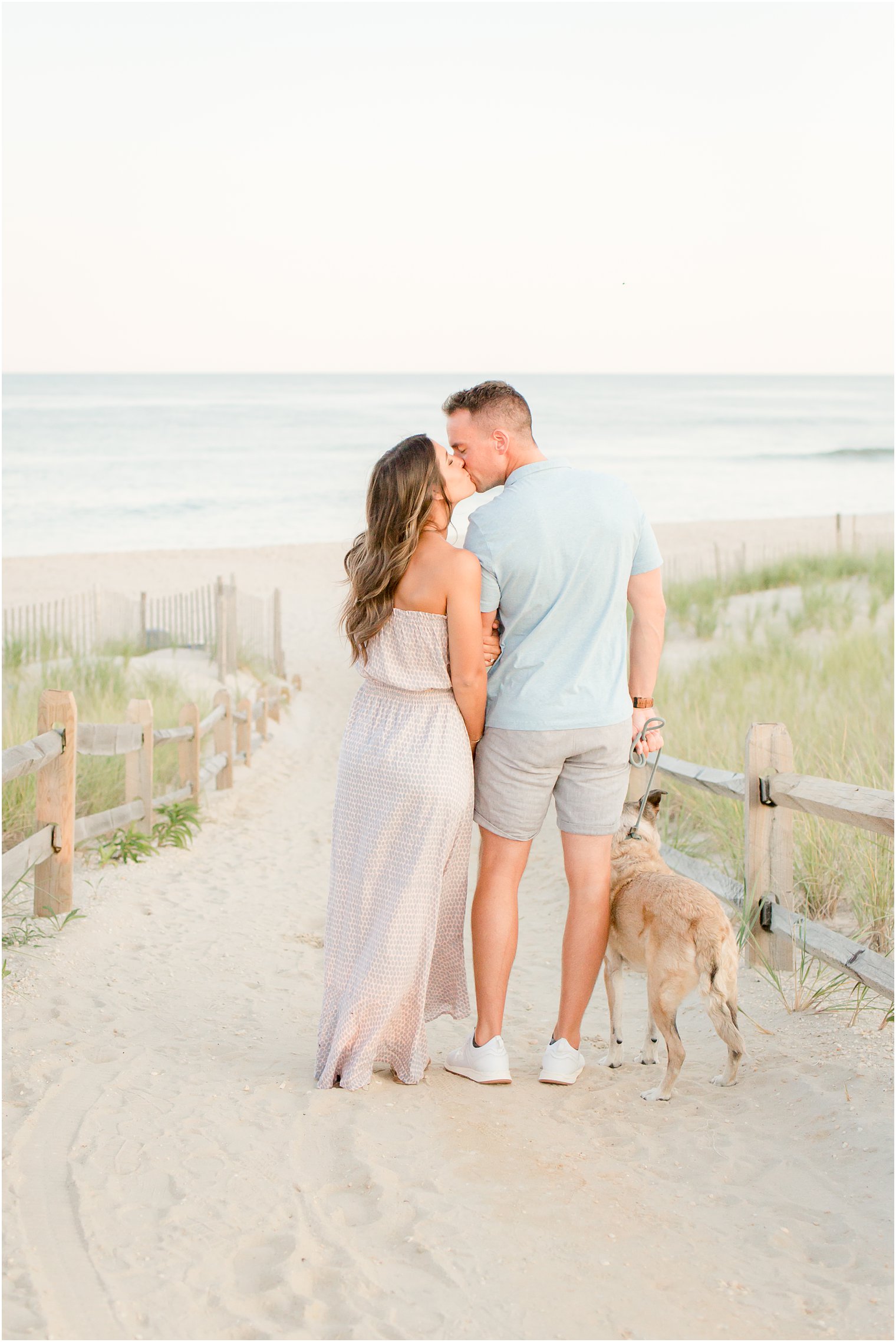engagement photos with dog on the beach