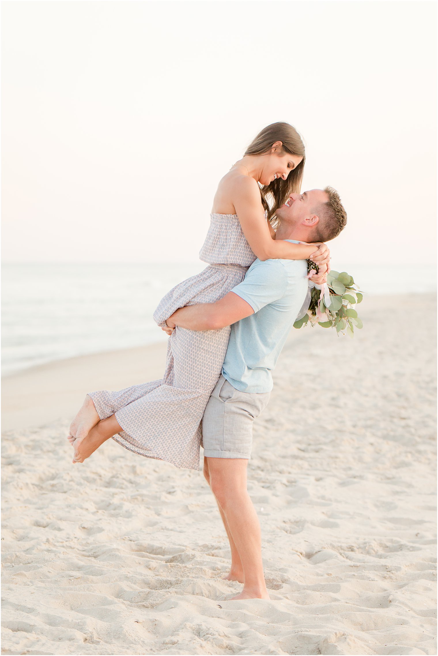 cute pose for engagement photos on the beach