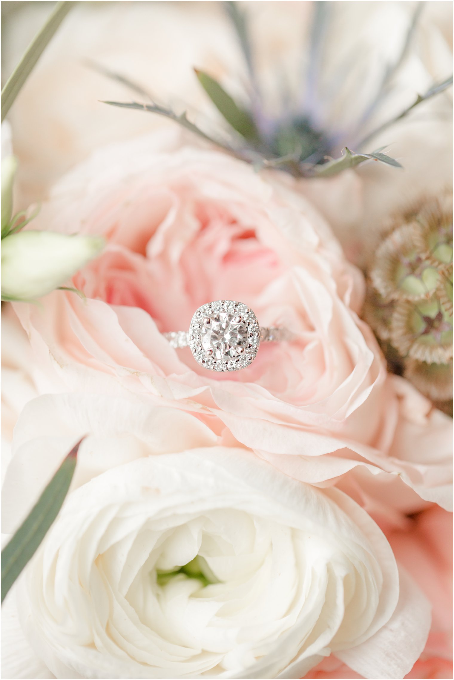 Heirloom wedding ring in a bouquet by Purple Iris Flower Shop