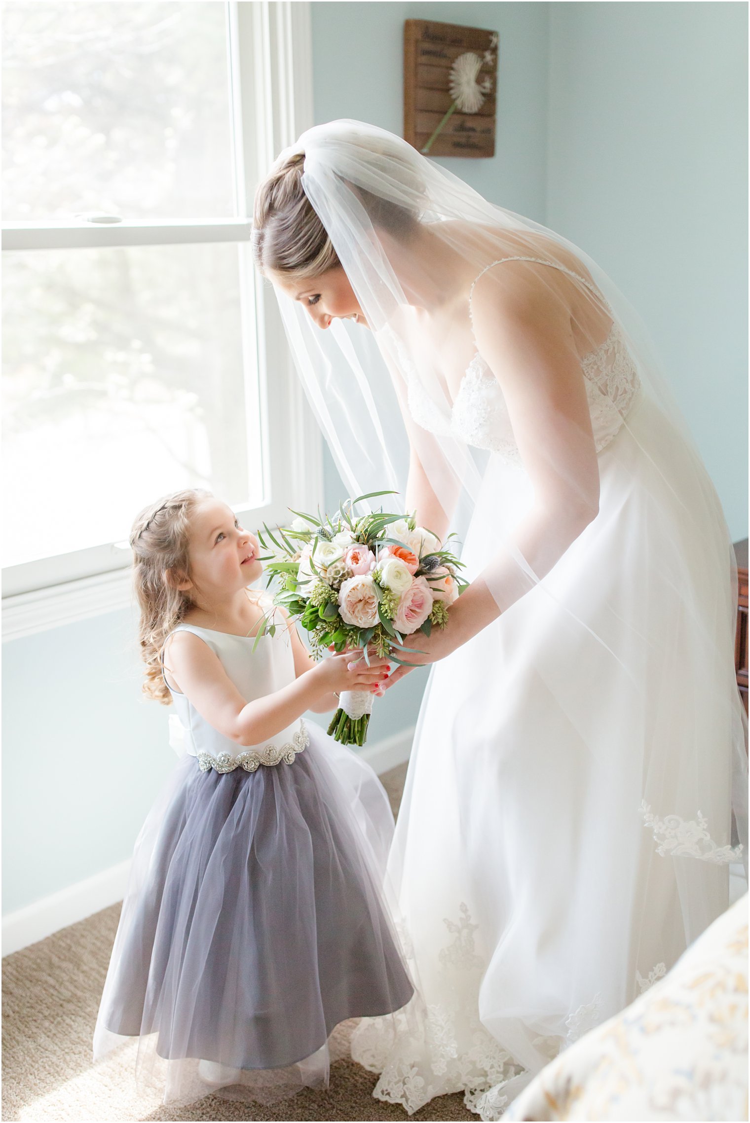 Bride and flower girl on wedding day