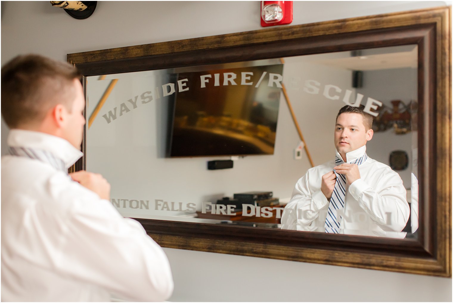 Groom getting ready in firehouse