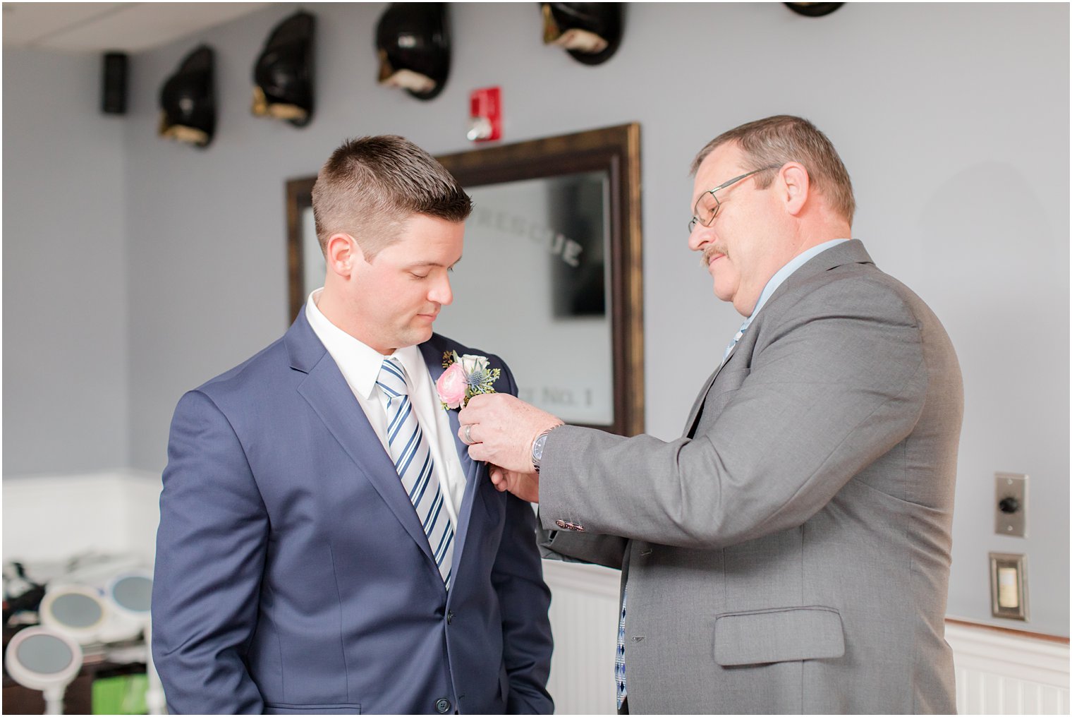 Groom getting ready with his father