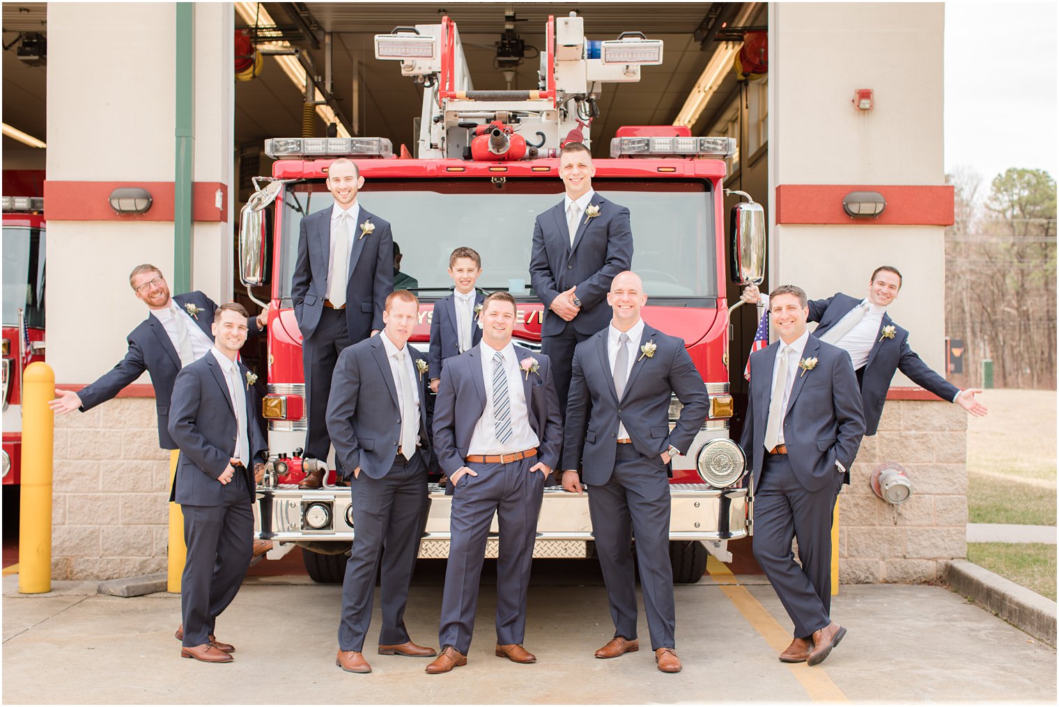 Groom and groomsmen with fire truck