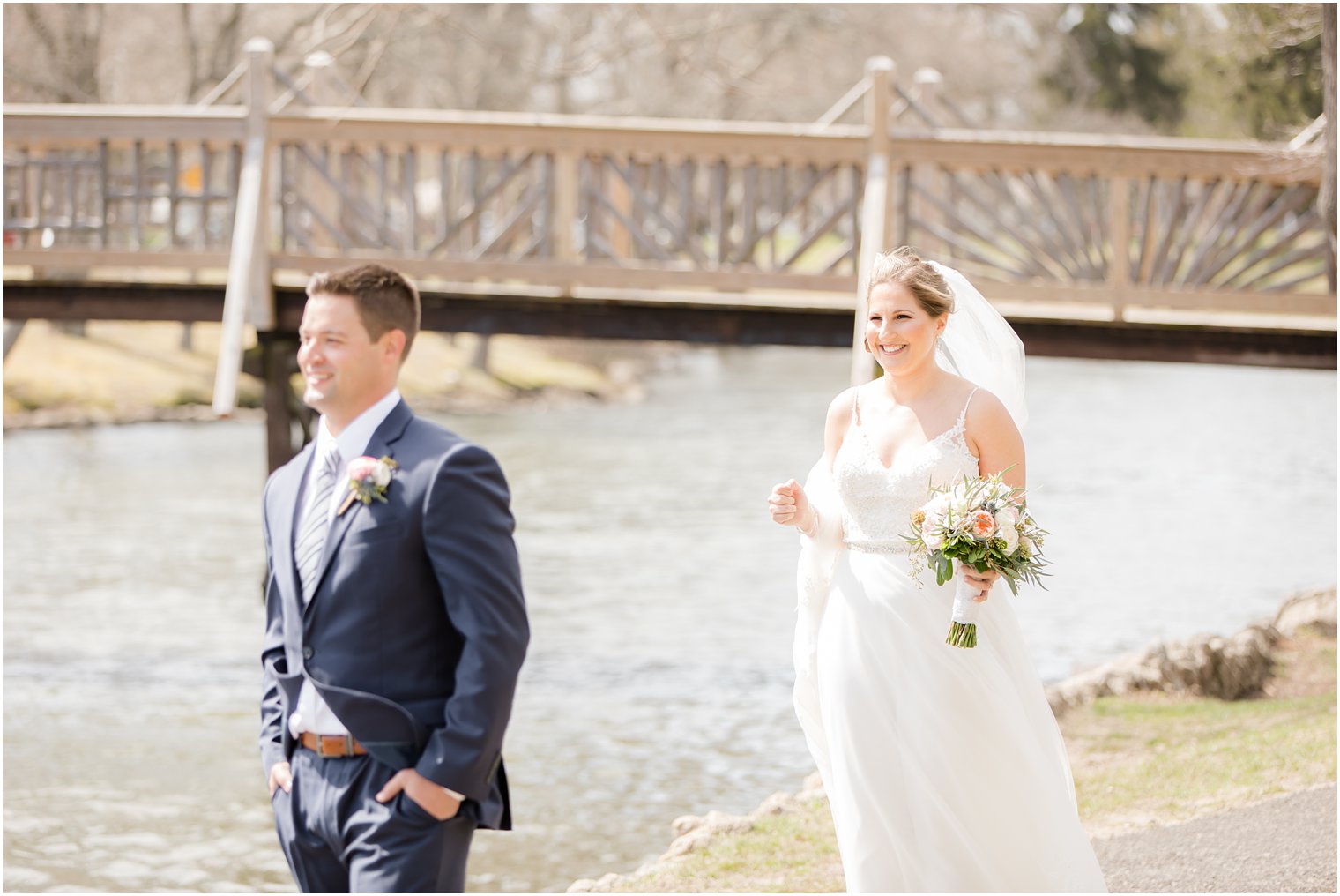 Bride and groom sharing a first look at Divine Park in Spring Lake 