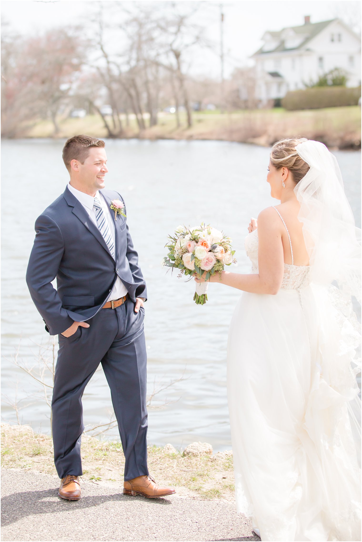 Bride and groom sharing a first look at Divine Park in Spring Lake 