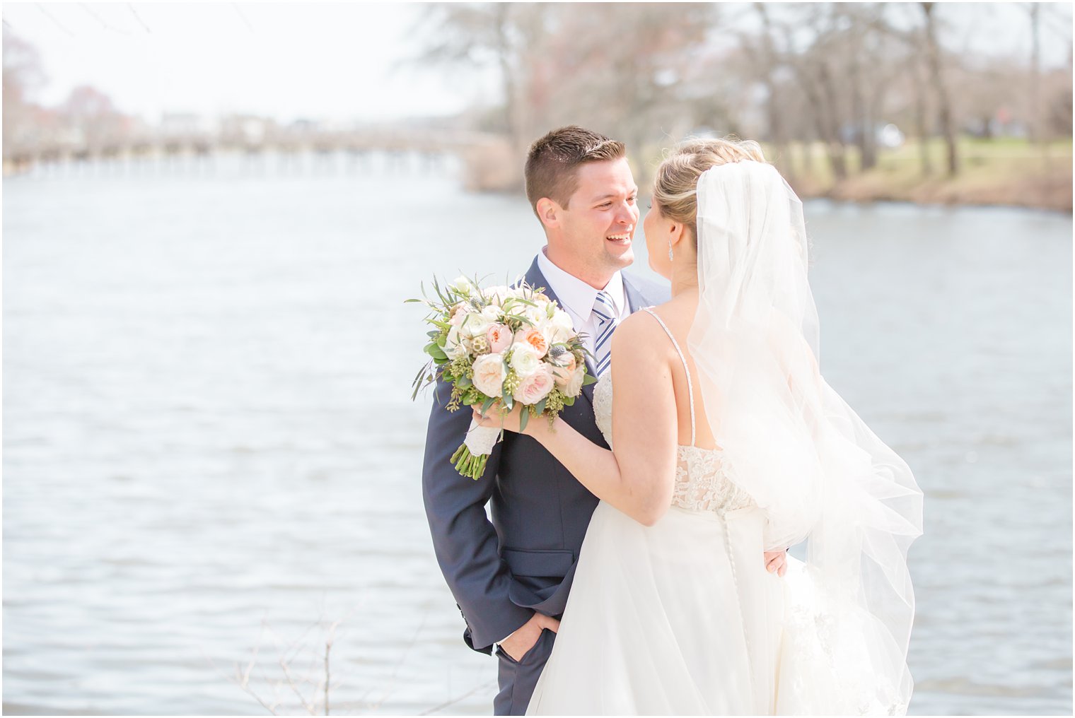 Bride and groom sharing a first look at Divine Park in Spring Lake 