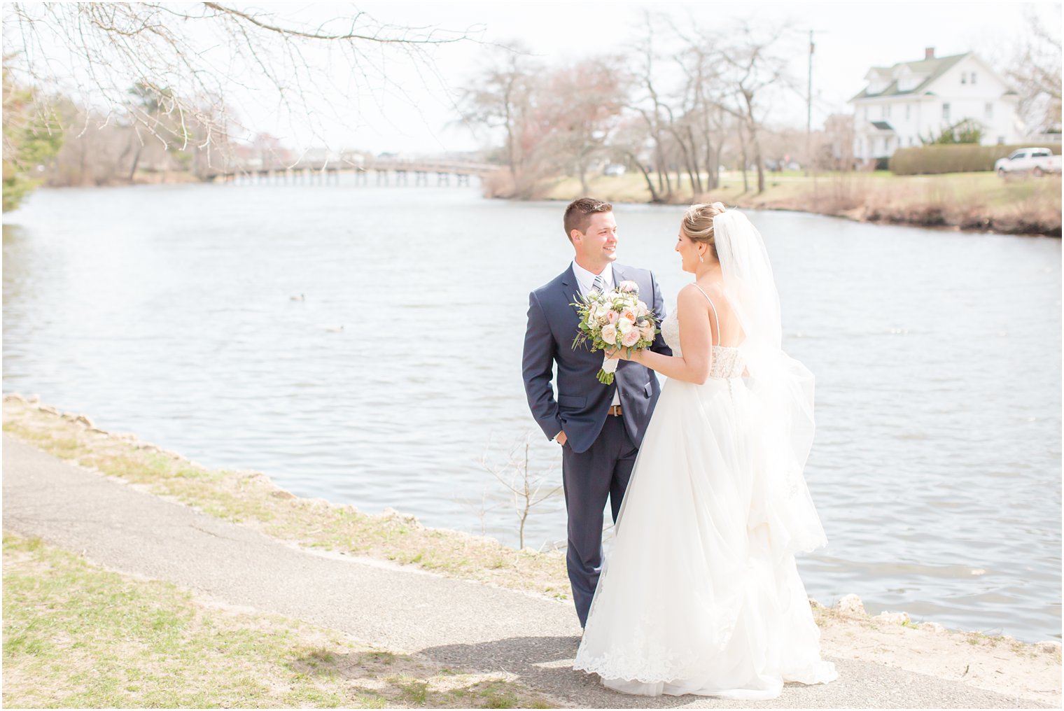 Bride and groom sharing a first look at Divine Park in Spring Lake 