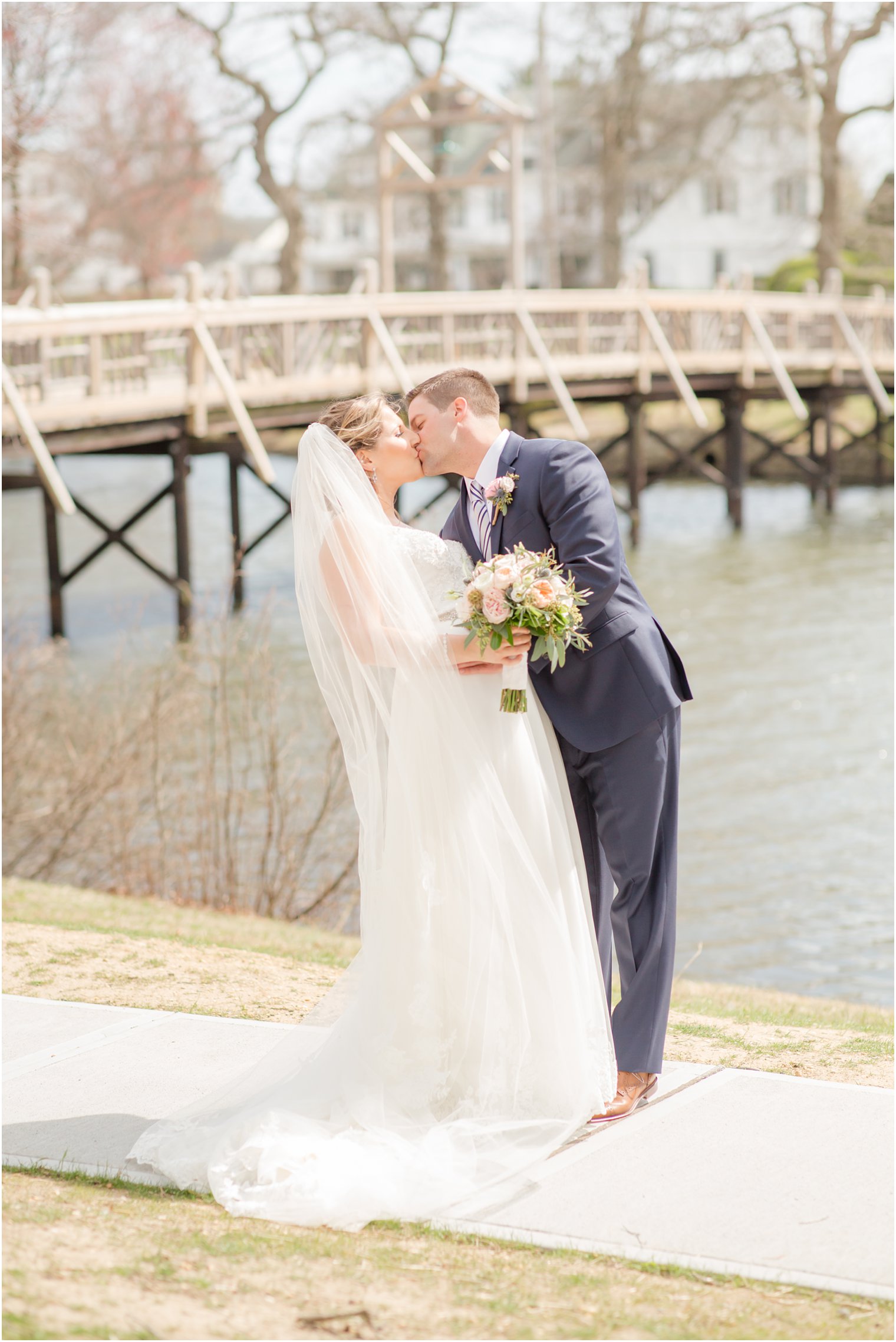 Romantic photo of bride and groom kissing