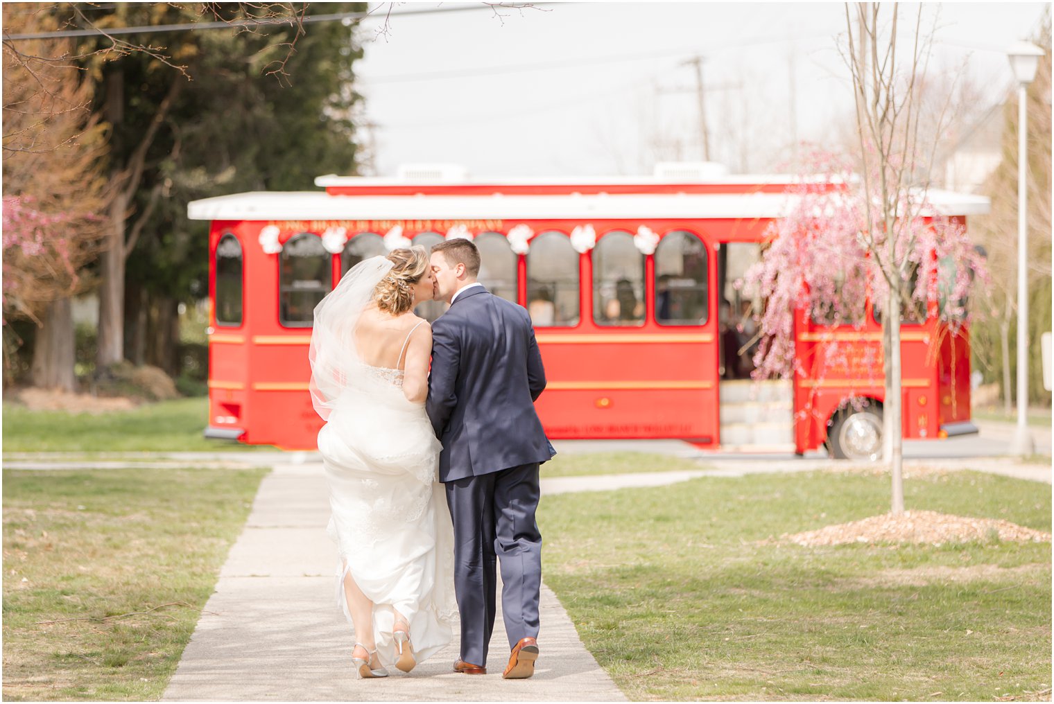 Bride and groom walking towards Long Branch Trolley